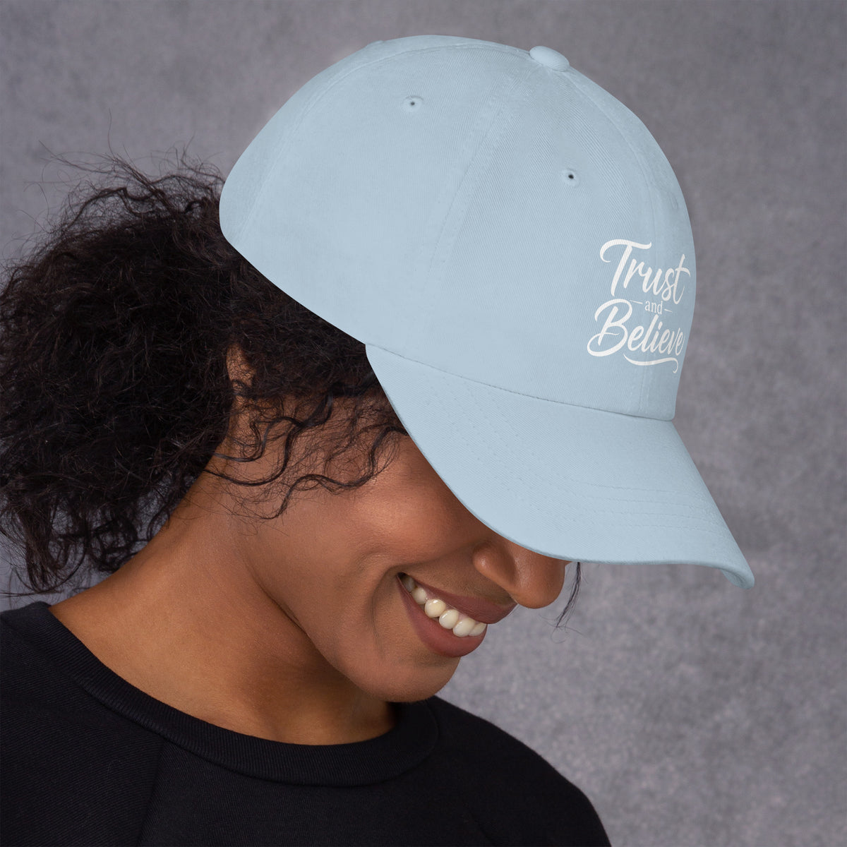 Trust and Believe design, on a light blue dad hat, right side view