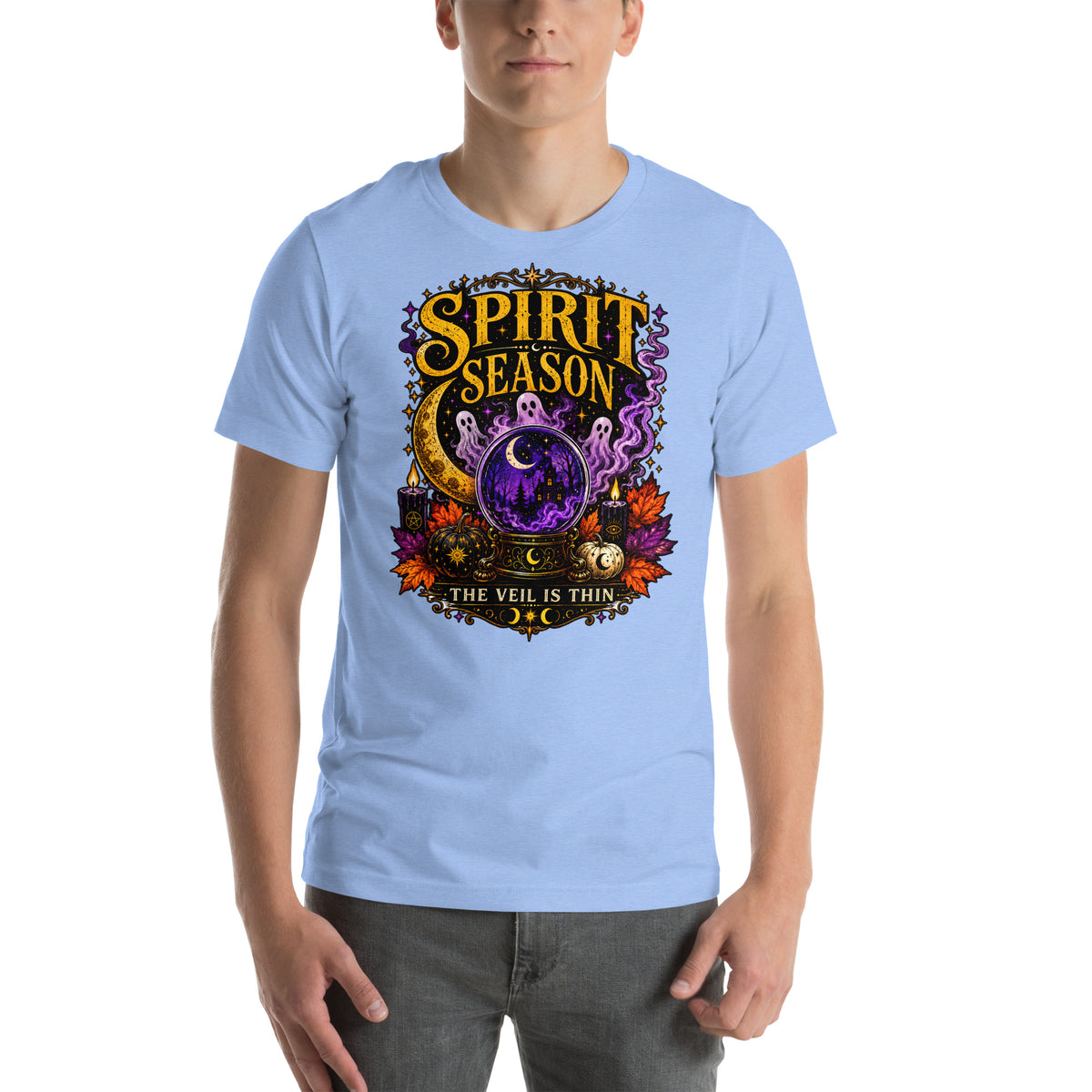 Spirit Season The Veil Is Thin design, three ghosts around a crystal ball, on a heather carolina blue unisex t-shirt, front view