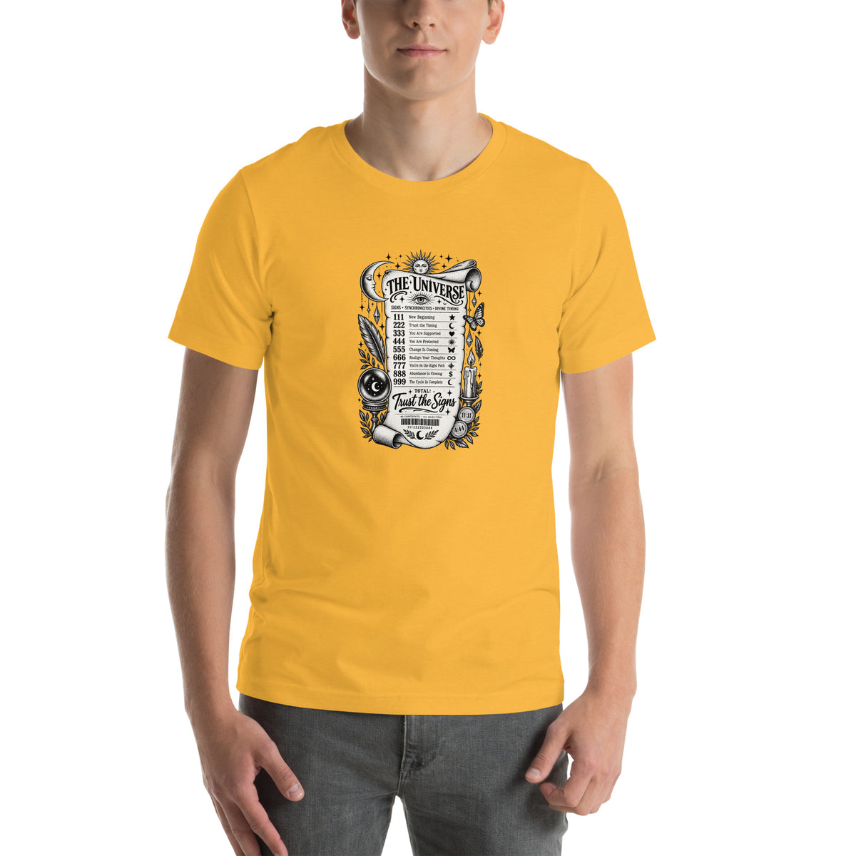 Trust the Signs design, a receipt from the Universe listing the angel numbers and their meanings, with a crystal ball and a candle, on a heather yellow gold unisex t-shirt, front view