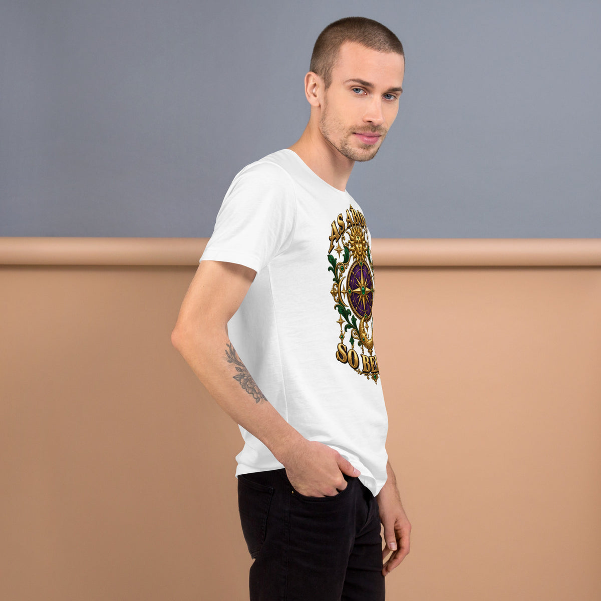 As Above, So Below astrology design, a gold sun face above a purple and gold compass rose with a crescent moon below, framed by emerald foliage, on a white unisex t-shirt, right view