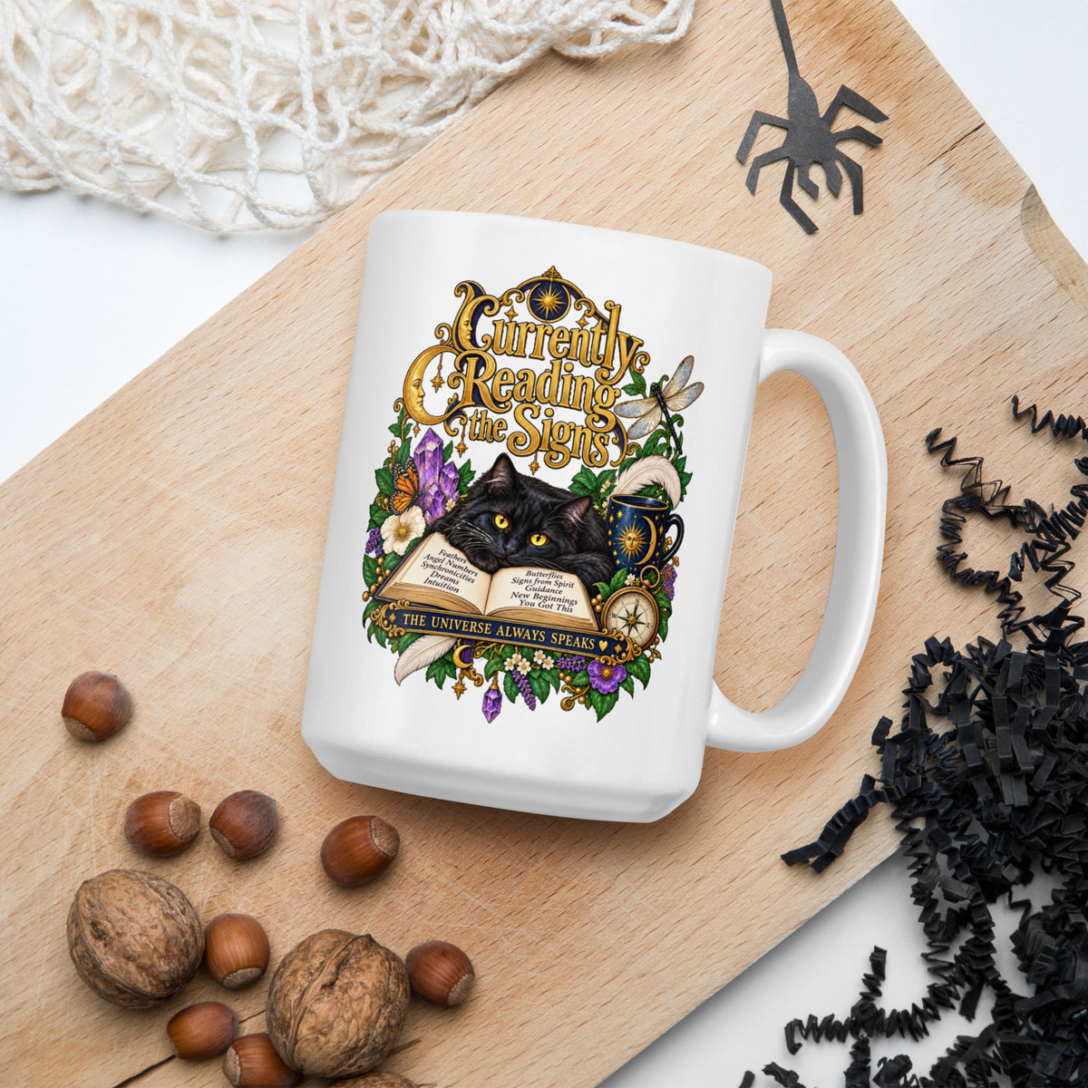 Currently Reading The Signs dark academia design, two black cats asleep over an open book beneath a crescent moon, on a white glossy mug, 15 oz, in a Halloween scene