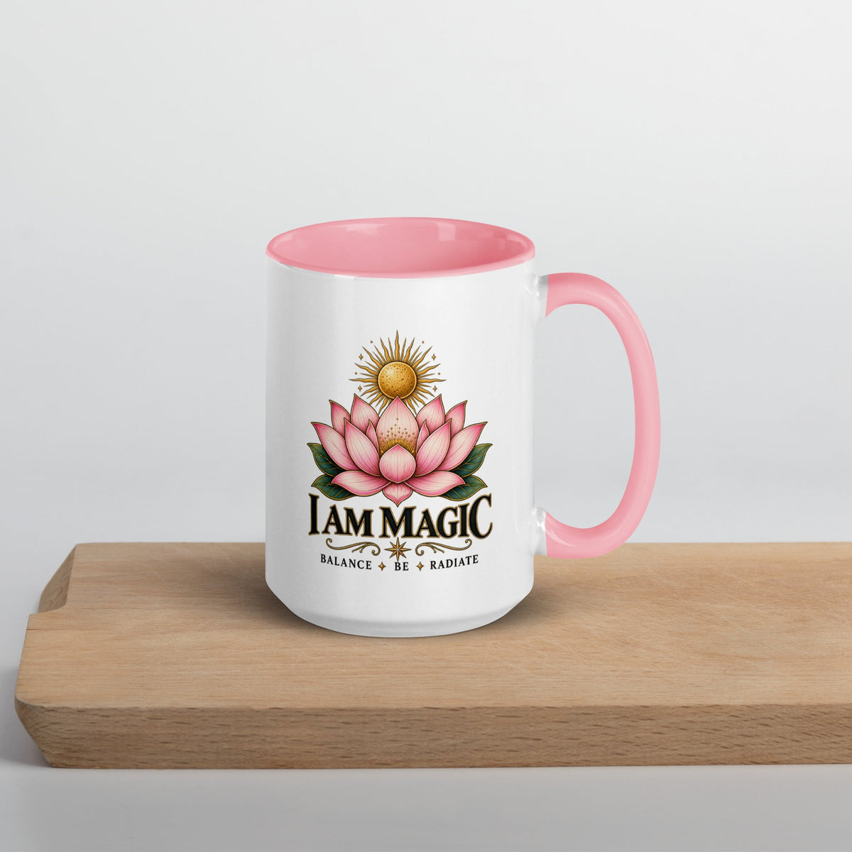 A 15 oz white ceramic mug with a pink interior, handle on the right