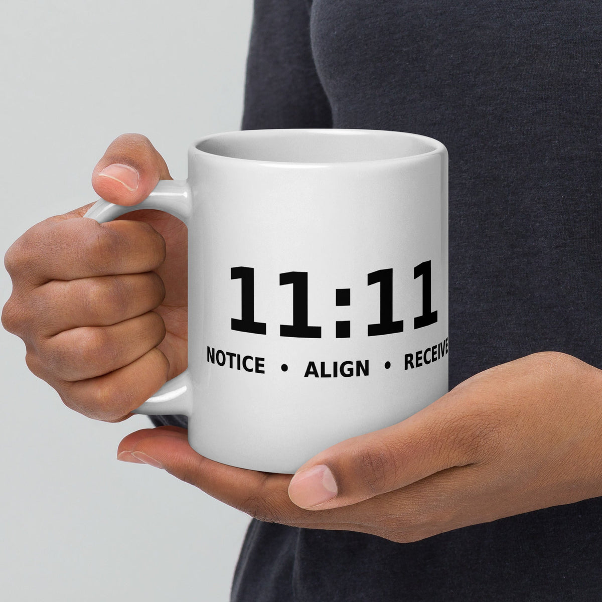 A 20 oz white glossy mug carrying the 11:11 design, handle on the left