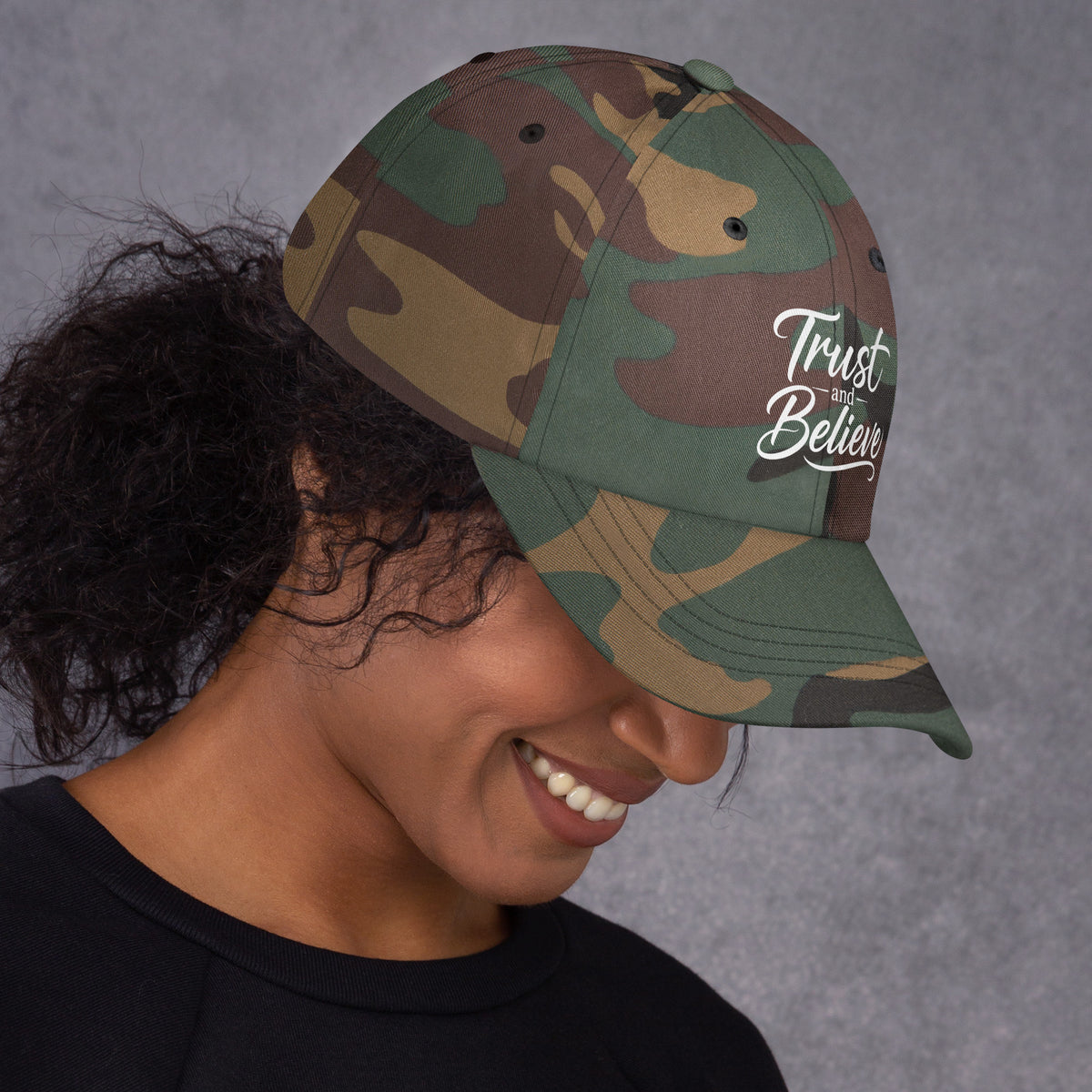 Trust and Believe design, on a green camo dad hat, right side view