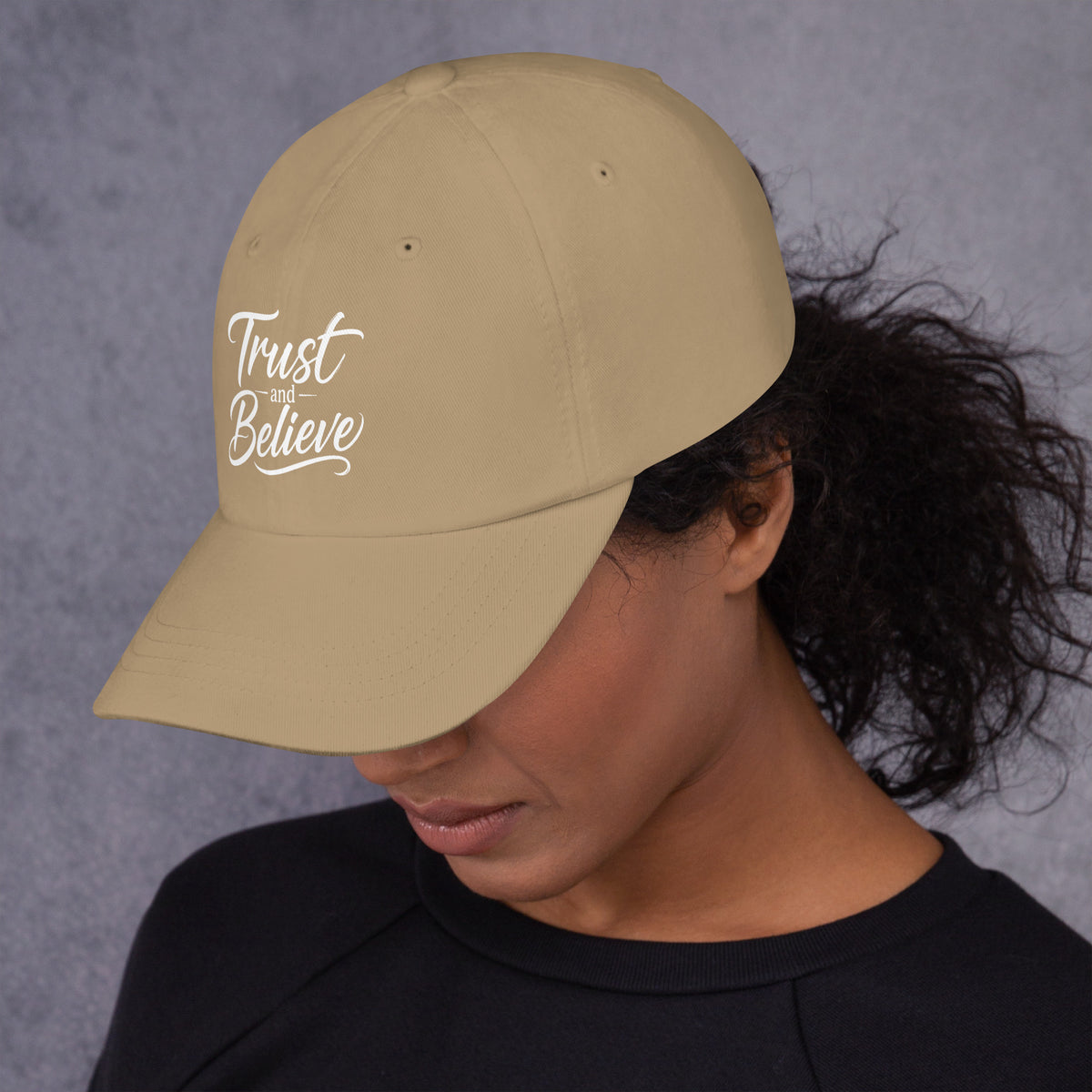 Trust and Believe design, on a khaki dad hat, left side view