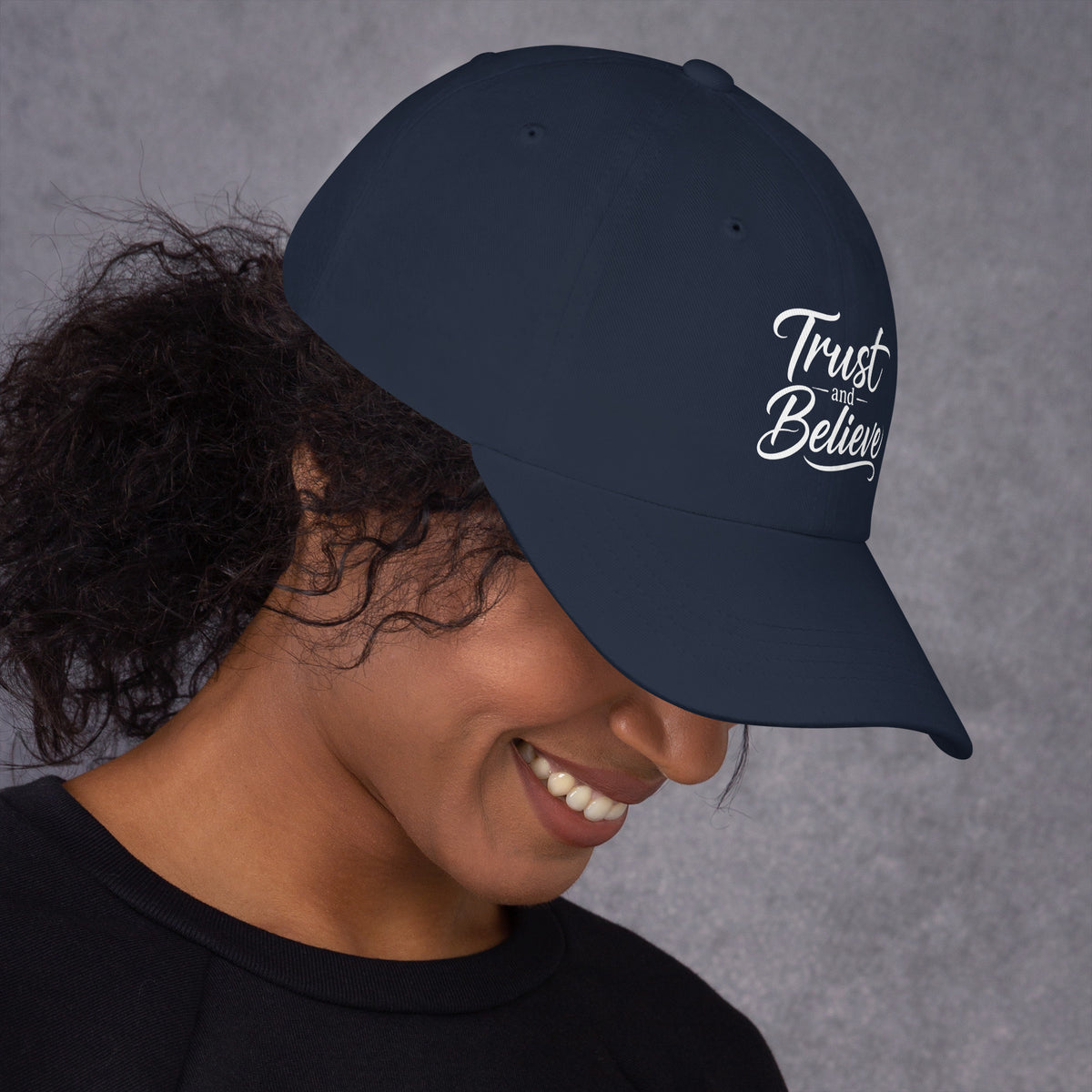 Trust and Believe design, on a navy dad hat, right side view