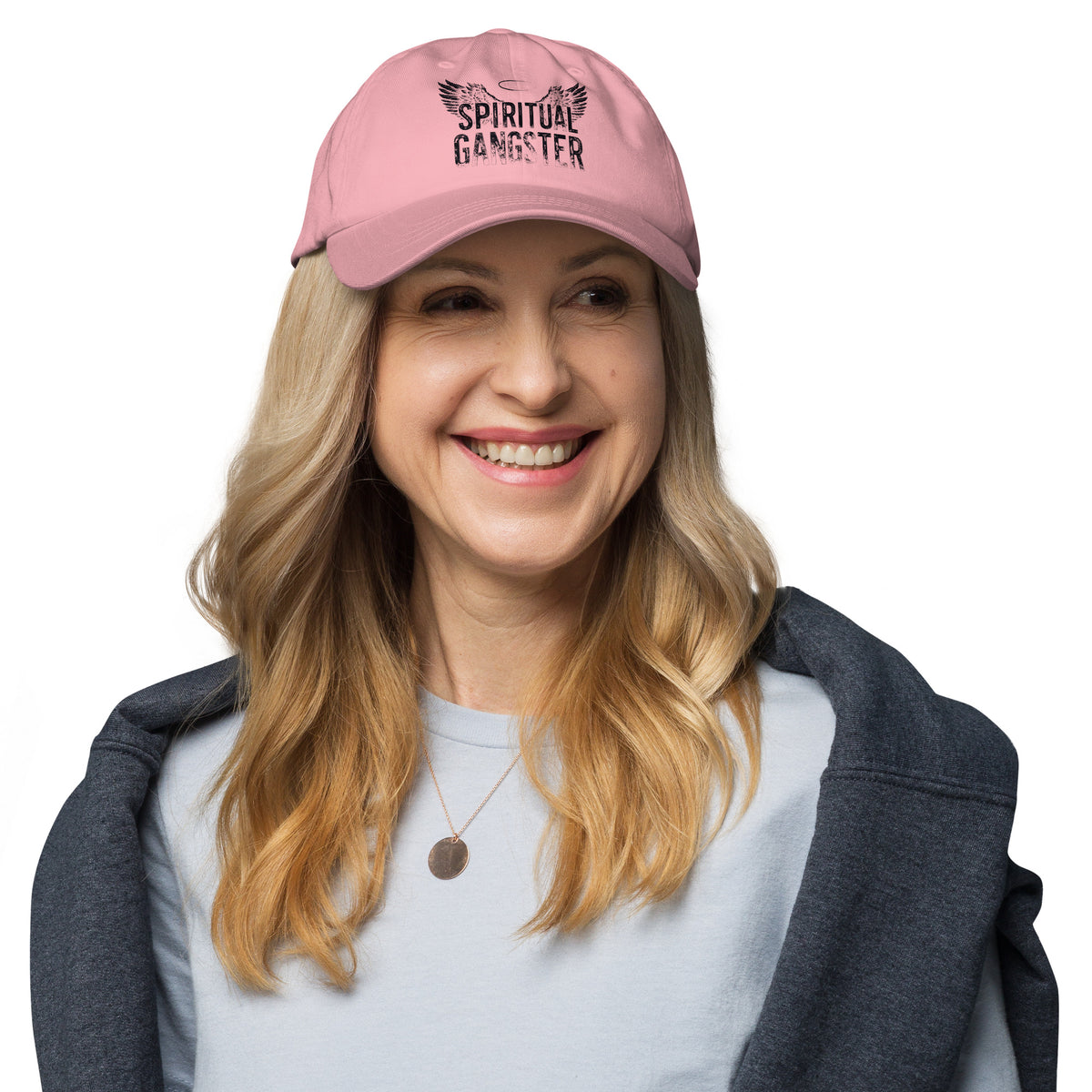 Spiritual Gangster design in black lettering, with angel wings and a halo, on a pink dad hat, front view