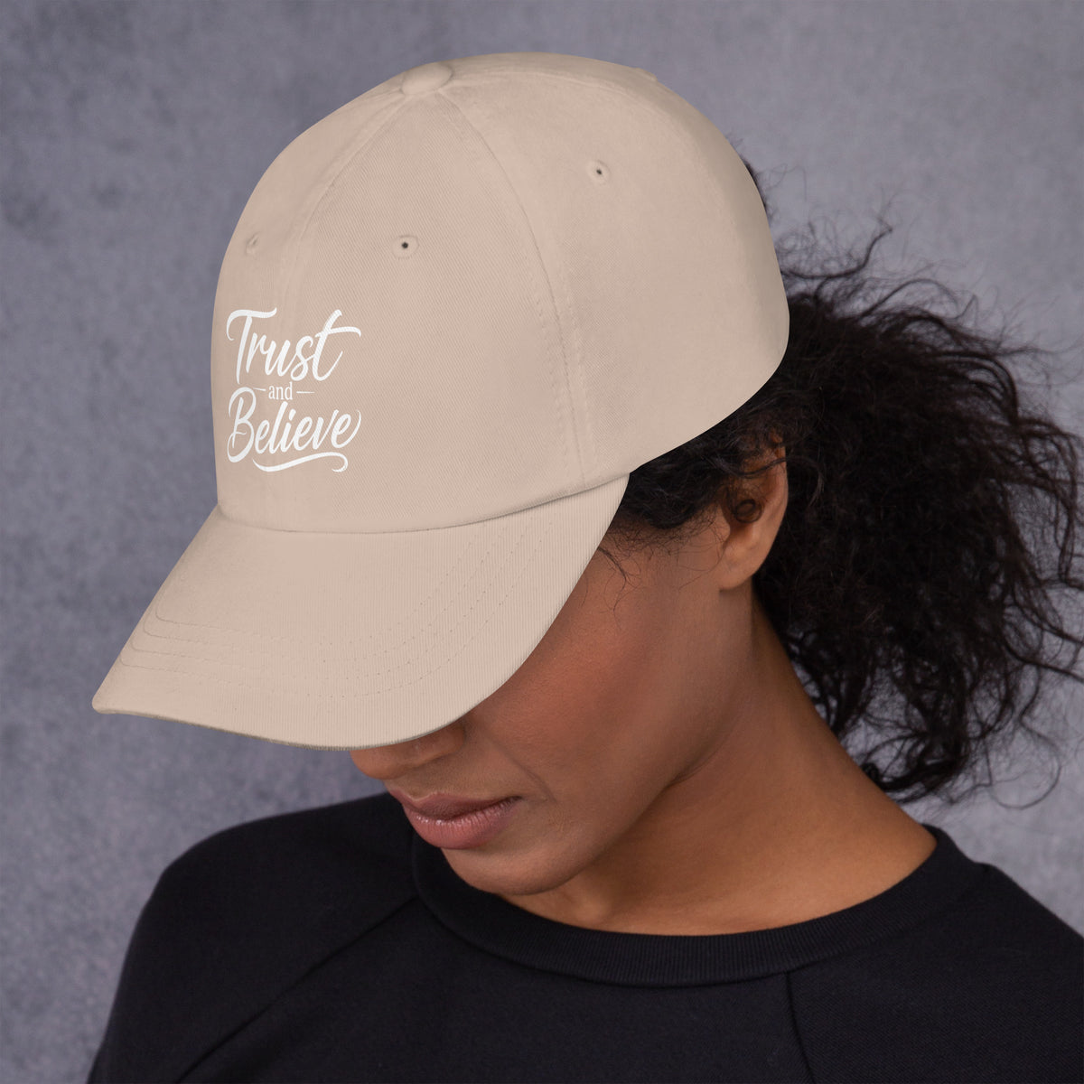 Trust and Believe design, on a stone dad hat, left side view