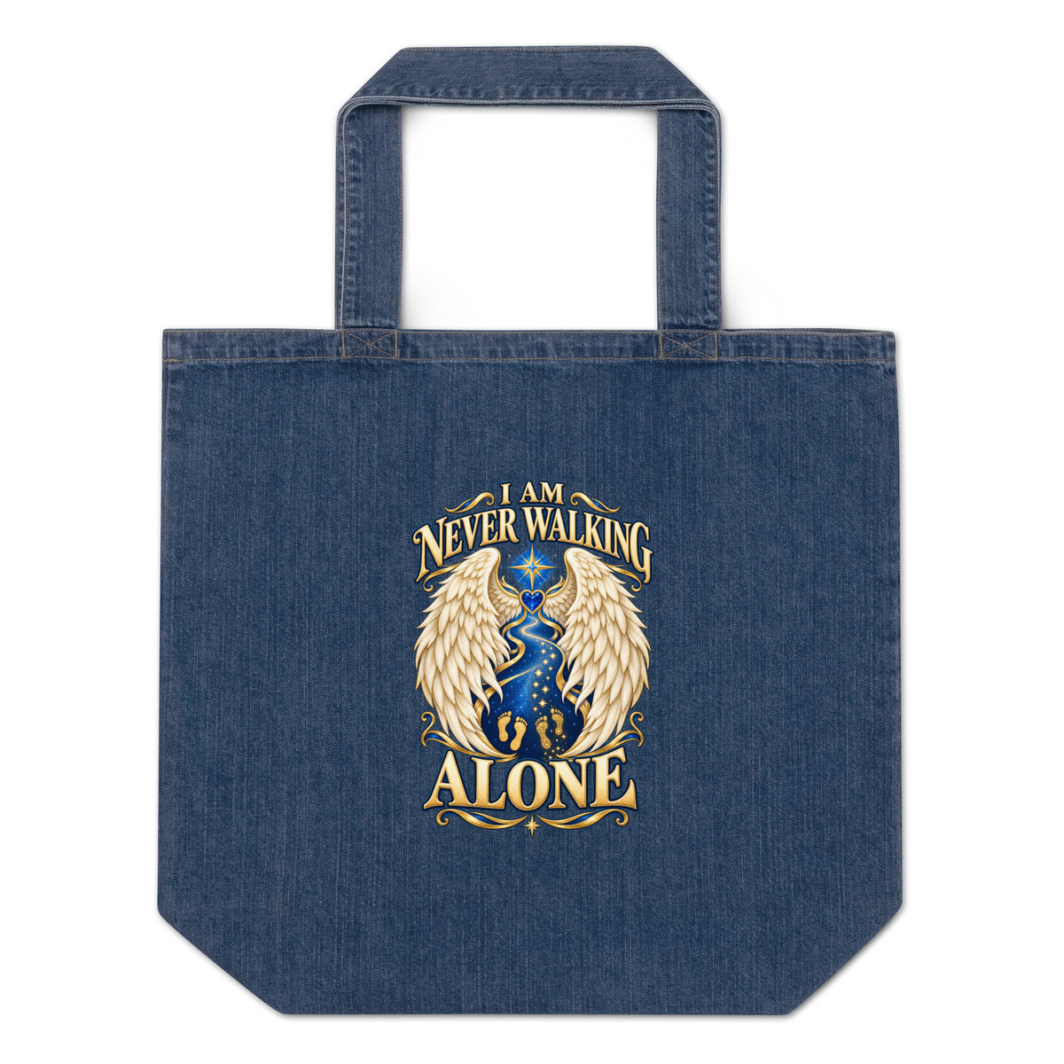 I Am Never Walking Alone design, cream angel wings framing a starry path with gold footprints and a blue gem heart, on a denim blue organic tote bag, front view