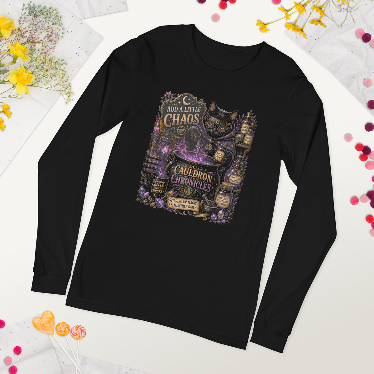 Add A Little Chaos whimsigoth design, a masked cat and a bubbling cauldron, on a black unisex long sleeve tee, front view detail