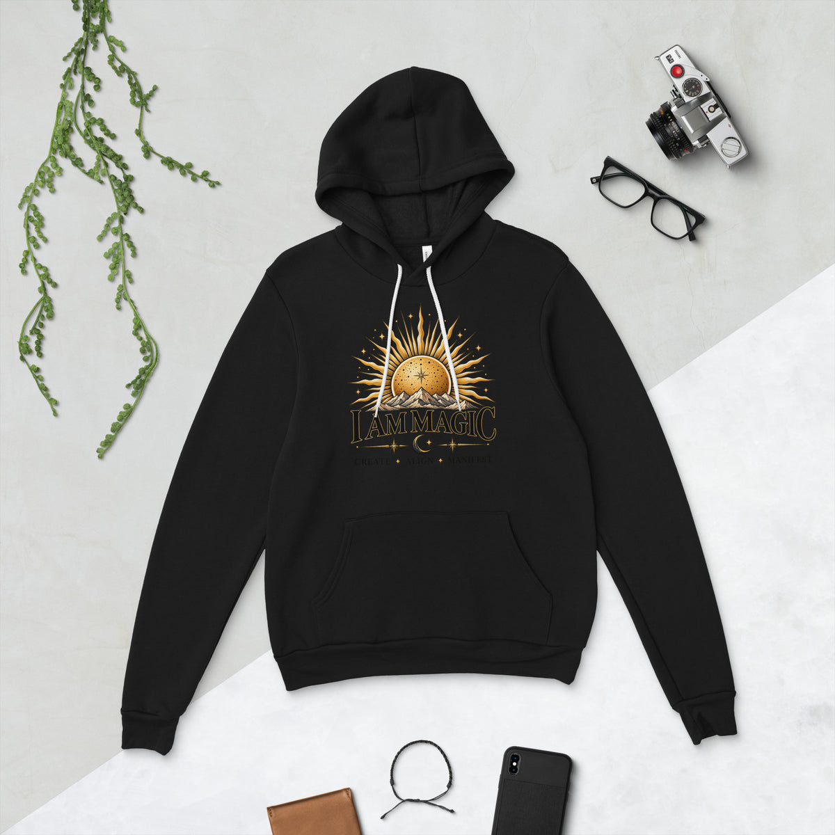 I Am Magic design with a gold sun face, Be Magical collection, on a black unisex pullover hoodie, front view