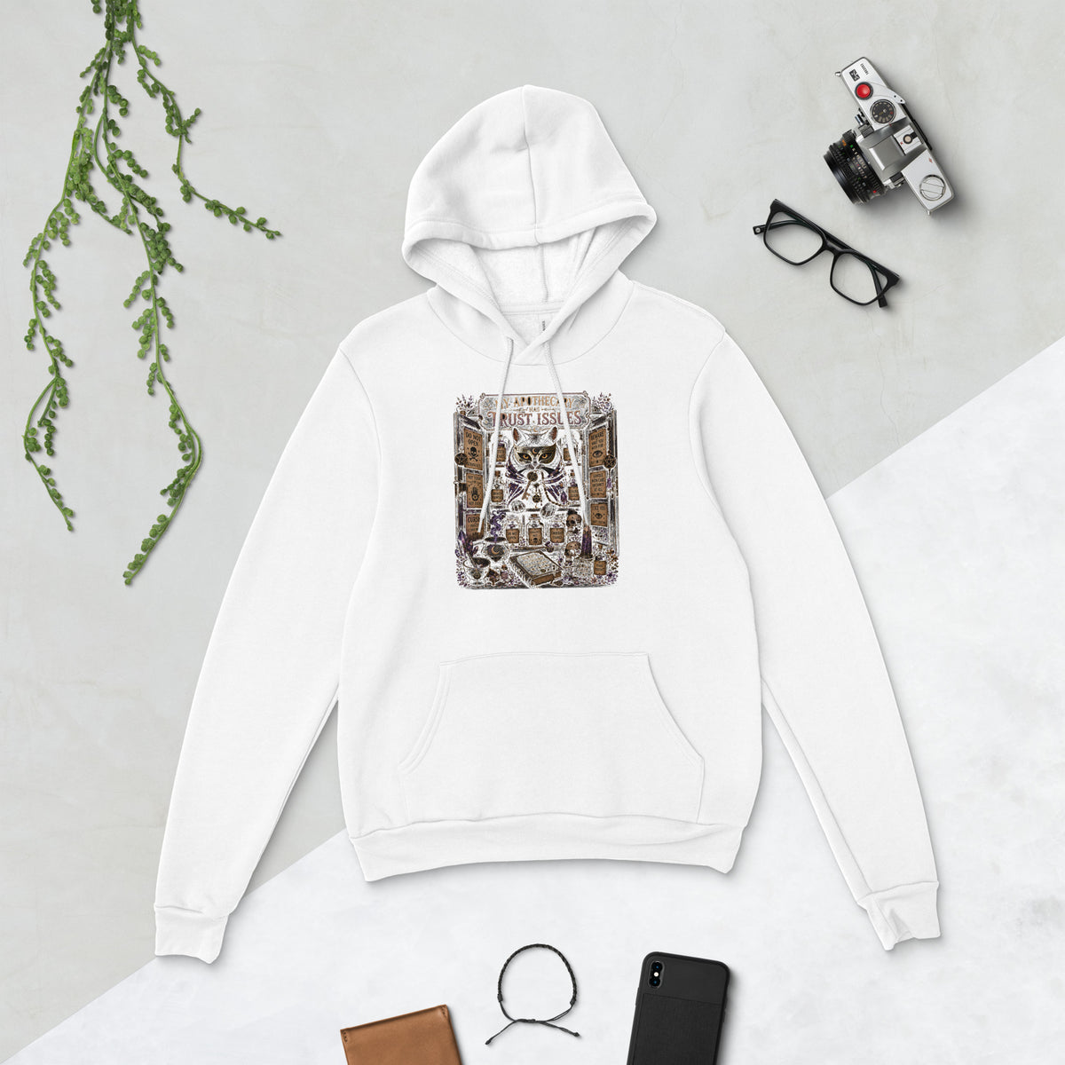 My Apothecary Has Trust Issues, a witchy black cat and a cabinet of potion bottles, on a white unisex pullover hoodie, front view