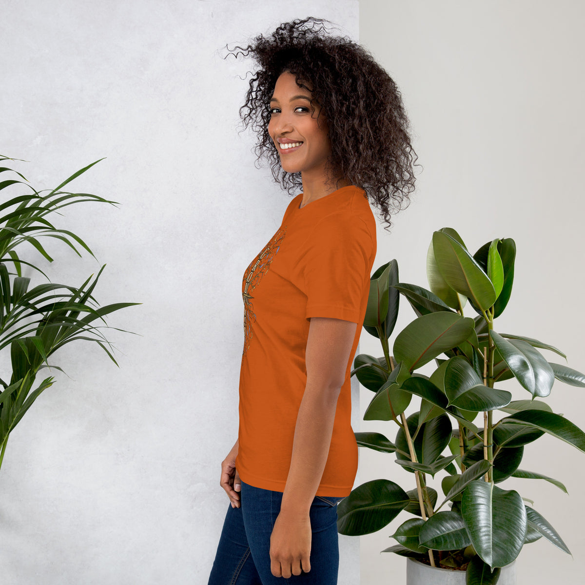 Own Your Grounded Energy design, an ornate tree with gold leaves and crystals in its roots, on an autumn unisex t-shirt, left side view