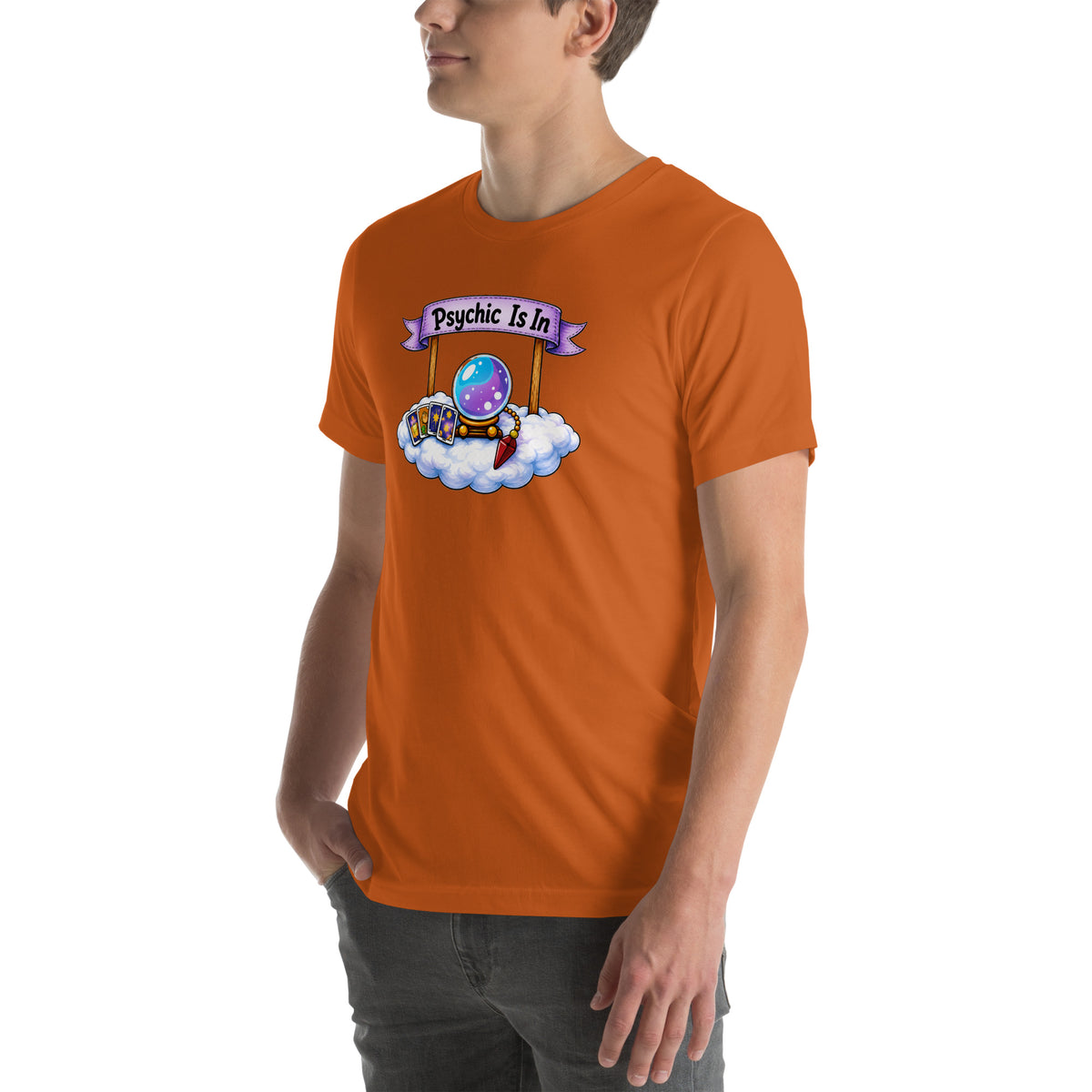 Psychic Is In design, playful floating clouds beneath a banner that reads Psychic Is Open for Business, on an autumn unisex t-shirt, angled left front view