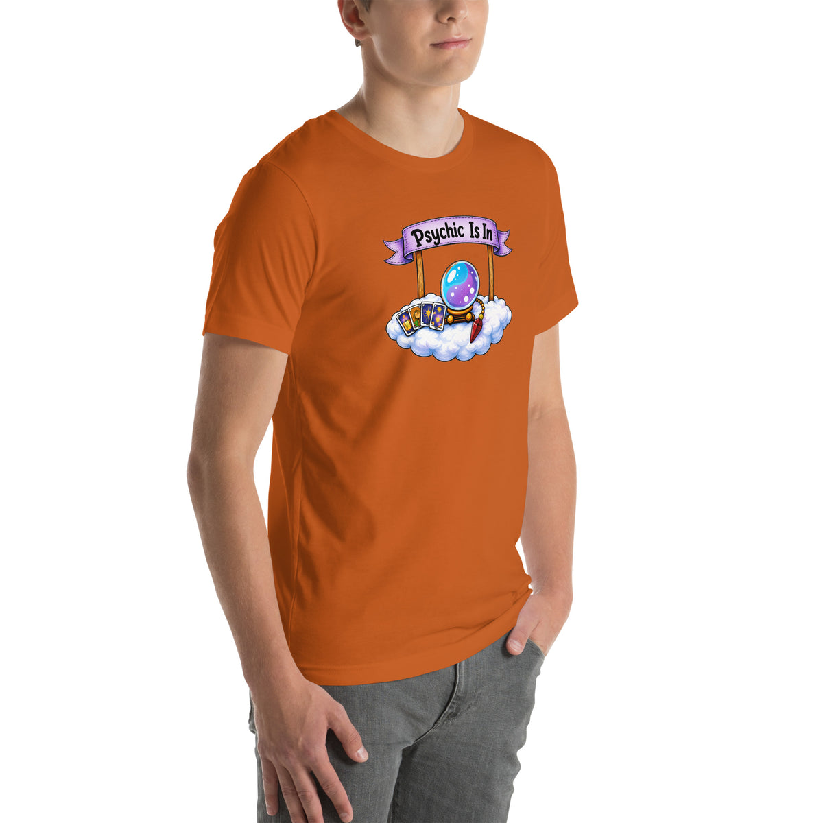 Psychic Is In design, playful floating clouds beneath a banner that reads Psychic Is Open for Business, on an autumn unisex t-shirt, angled right front view