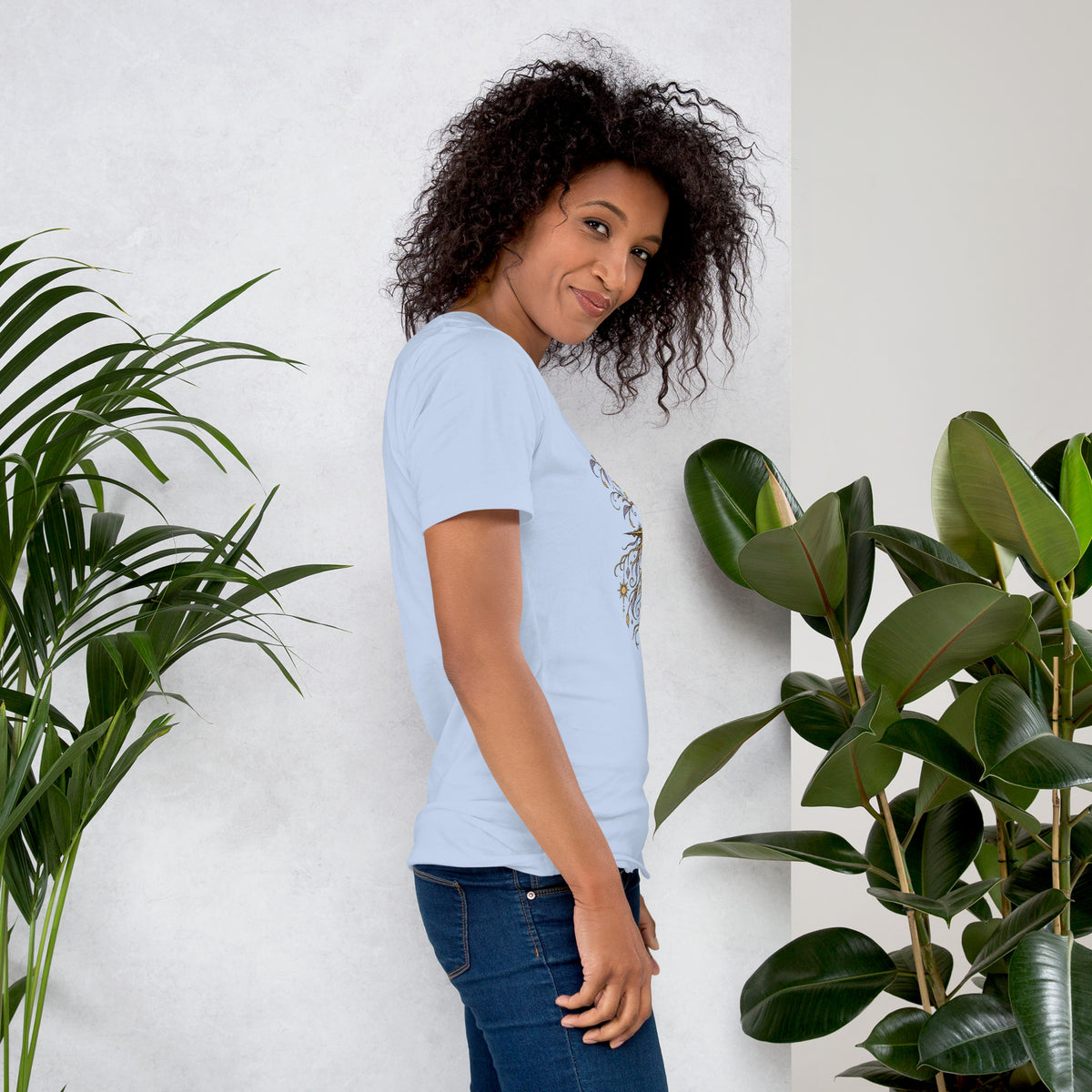 Own Your Grounded Energy design, an ornate tree with gold leaves and crystals in its roots, on a baby blue unisex t-shirt, right side view