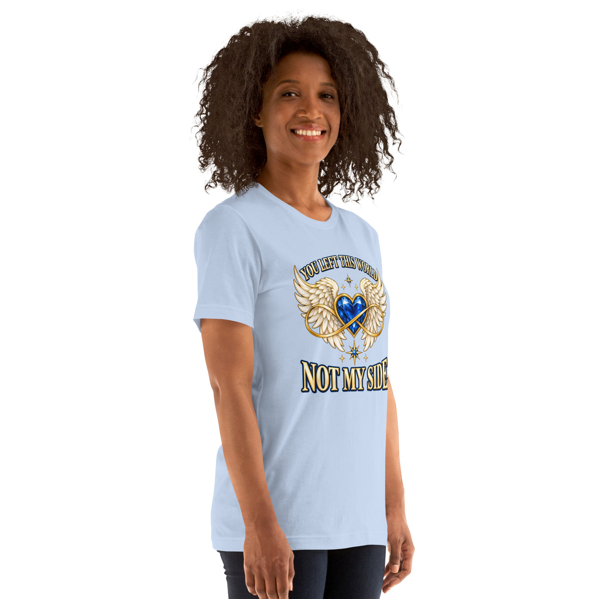 You Left This World Not My Side design, a blue gem heart with cream angel wings and a gold infinity ribbon under gold lettering, on a baby blue unisex t-shirt worn by a model, angled to the right