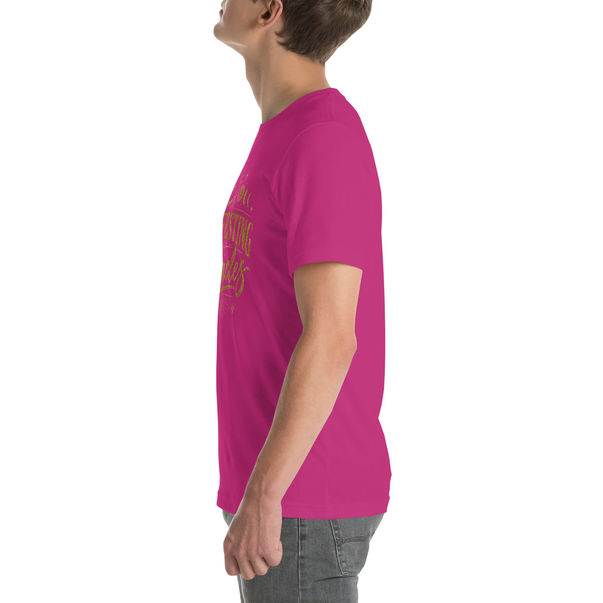 Manifesting Miracles design with moon phases in antique gold, on a berry unisex t-shirt, left side view