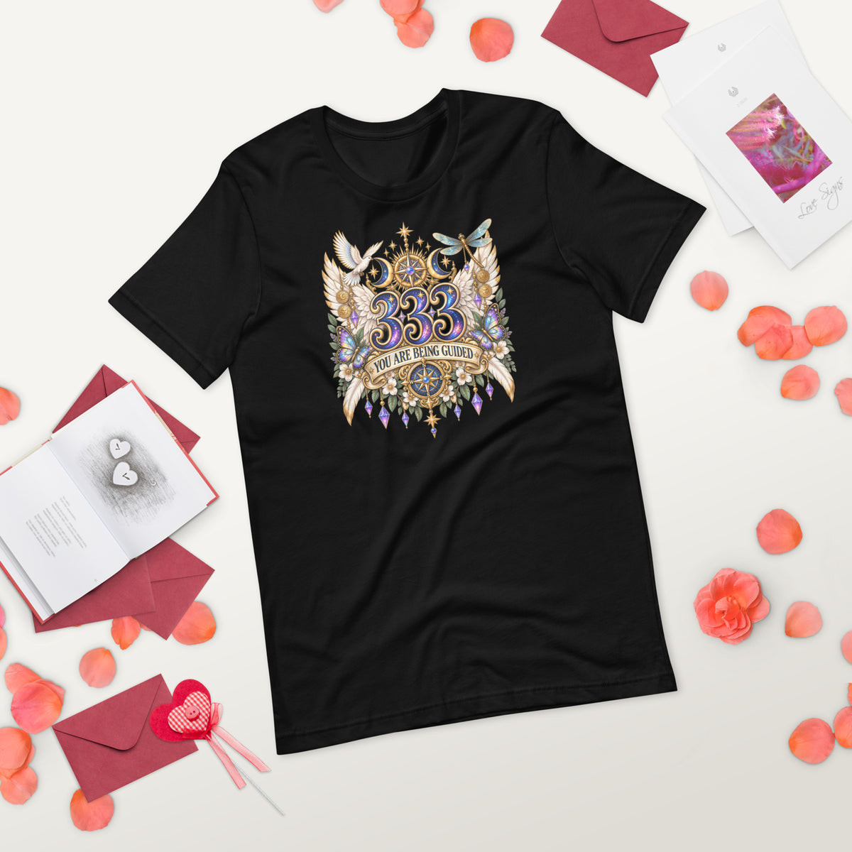 333 You Are Being Guided angel number design, a white dove, angel wings, a dragonfly and a compass rose, on a black unisex t-shirt, front view, alternate shot