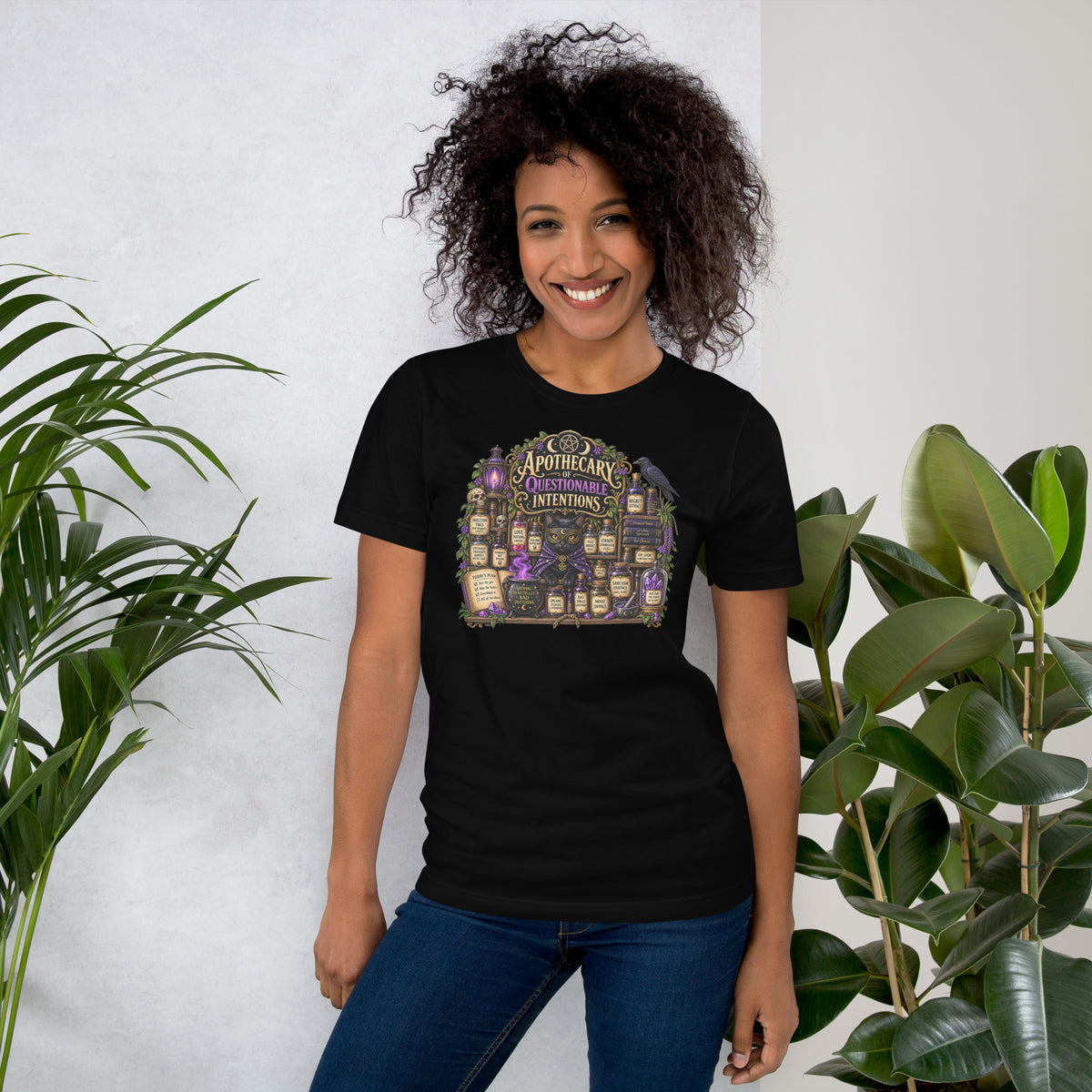 Apothecary of Questionable Intentions, a witchy black cat and two dozen potion bottles, on a black unisex t-shirt, front view
