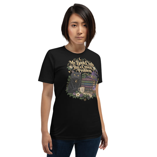 My Book Club Has A Coven Problem dark academia design, a witchy black cat and a stack of spellbooks, on a black unisex t-shirt, front view