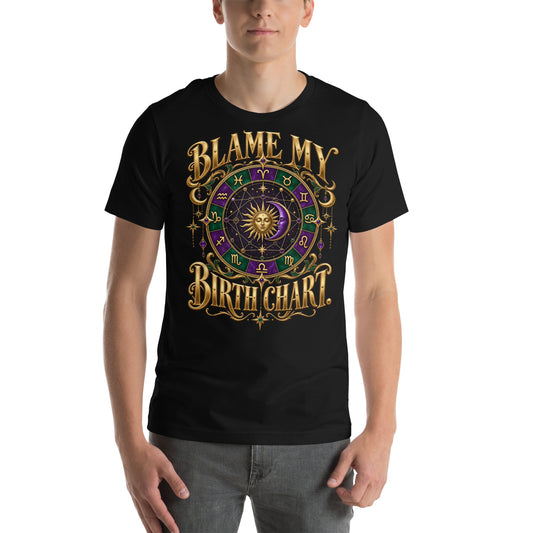 Blame My Birth Chart astrology design, a purple and green zodiac wheel with a gold sun face and crescent moon at its center, hung with gold ornaments, on a black unisex t-shirt, front view
