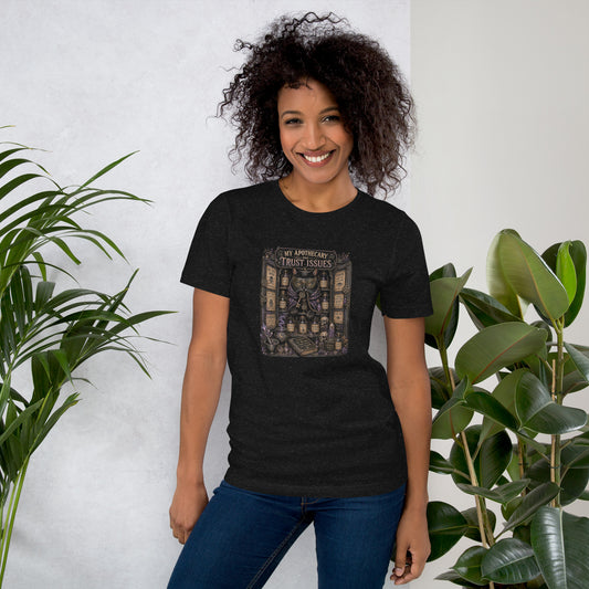 My Apothecary Has Trust Issues, a witchy black cat and a cabinet of potion bottles, on a black heather unisex t-shirt, front view