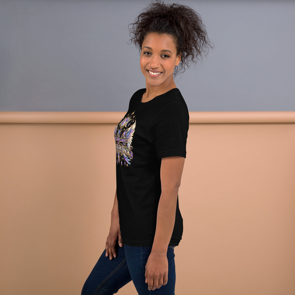444 Spirit Has My Back angel number design, angel wings flanking the number beneath a galaxy orb and crescent moons, on a black unisex t-shirt, left side view