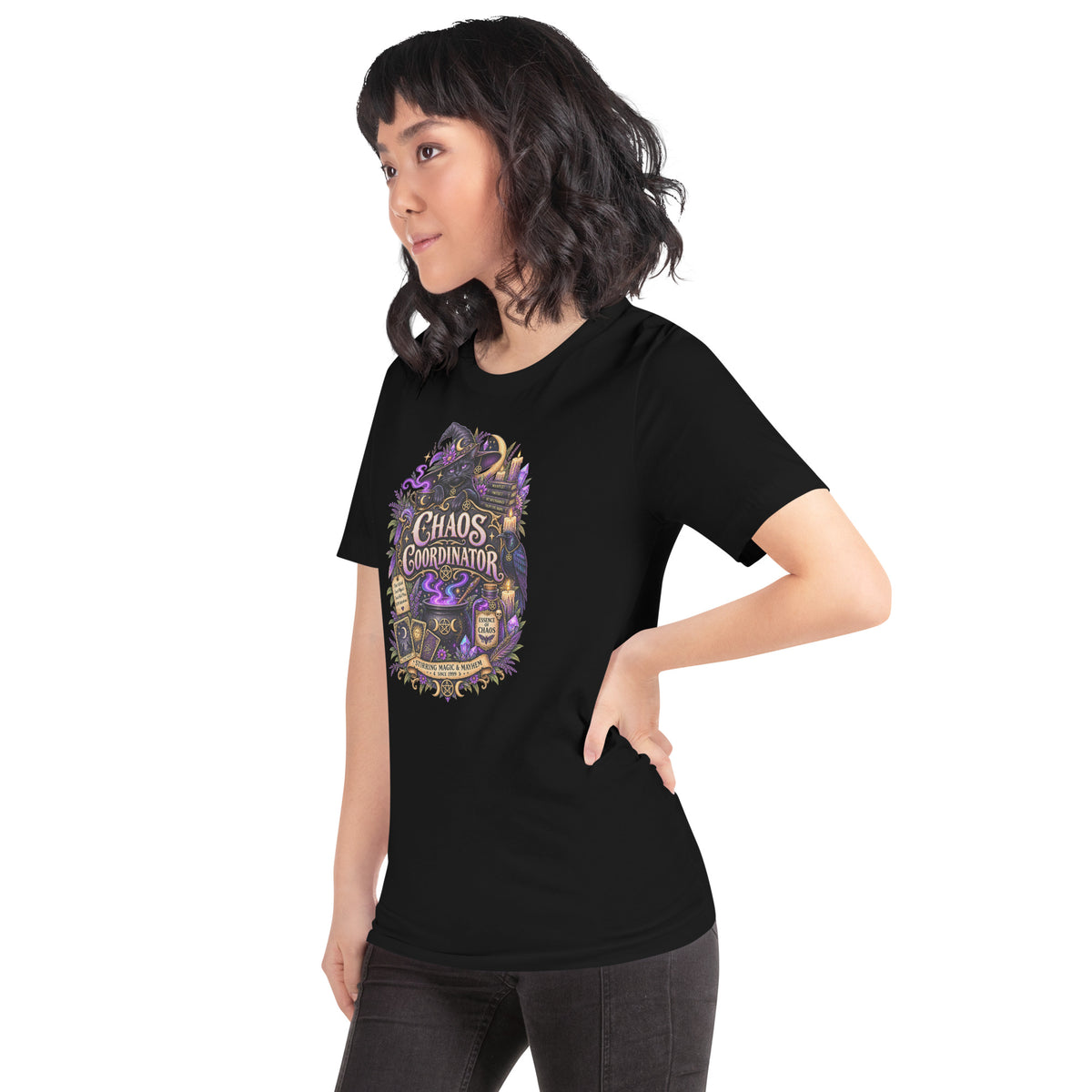 Chaos Coordinator whimsigoth design, a witchy black cat in a pointed hat, on a black unisex t-shirt, left front view