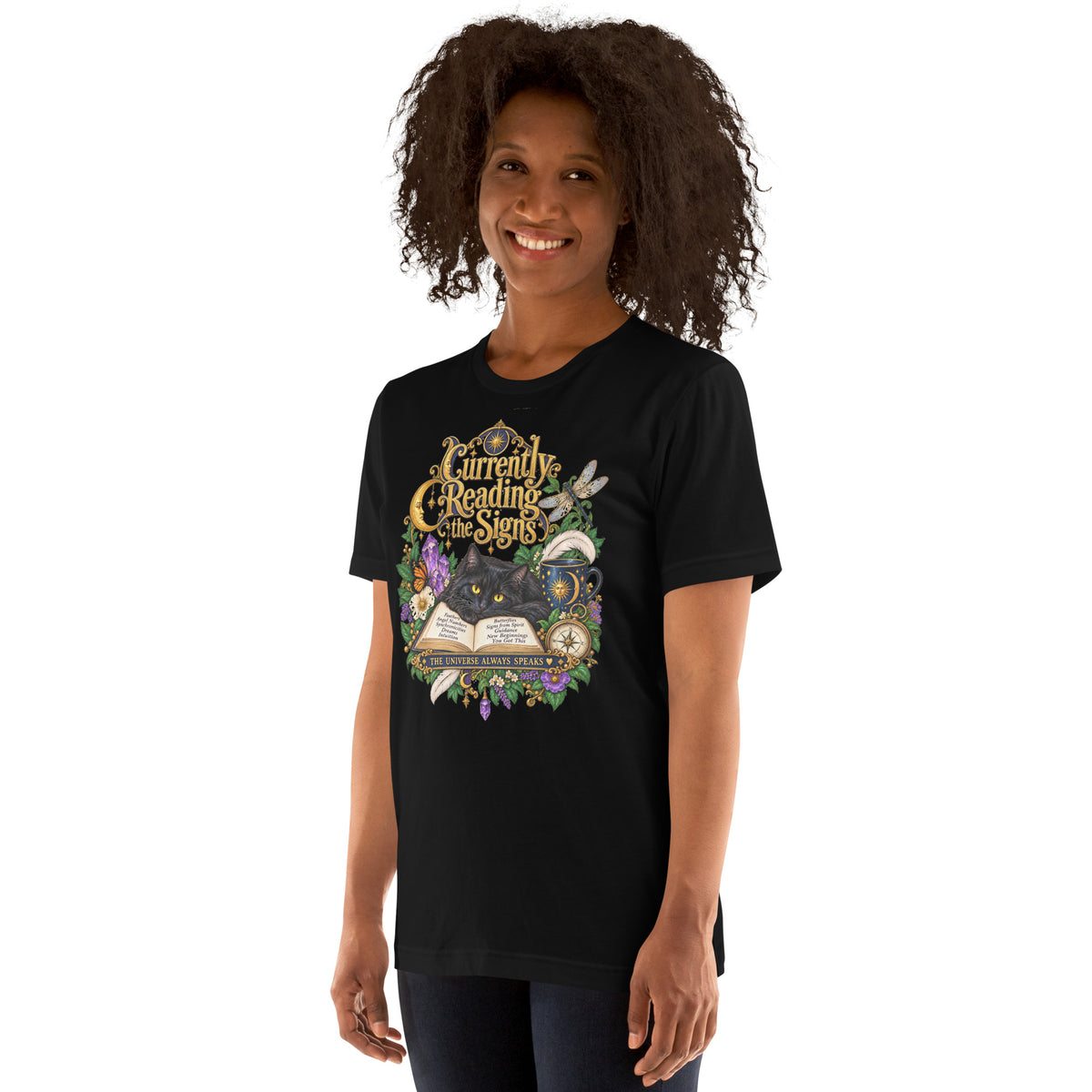 Currently Reading The Signs dark academia design, two black cats asleep over an open book beneath a crescent moon, on a black unisex t-shirt, left front view