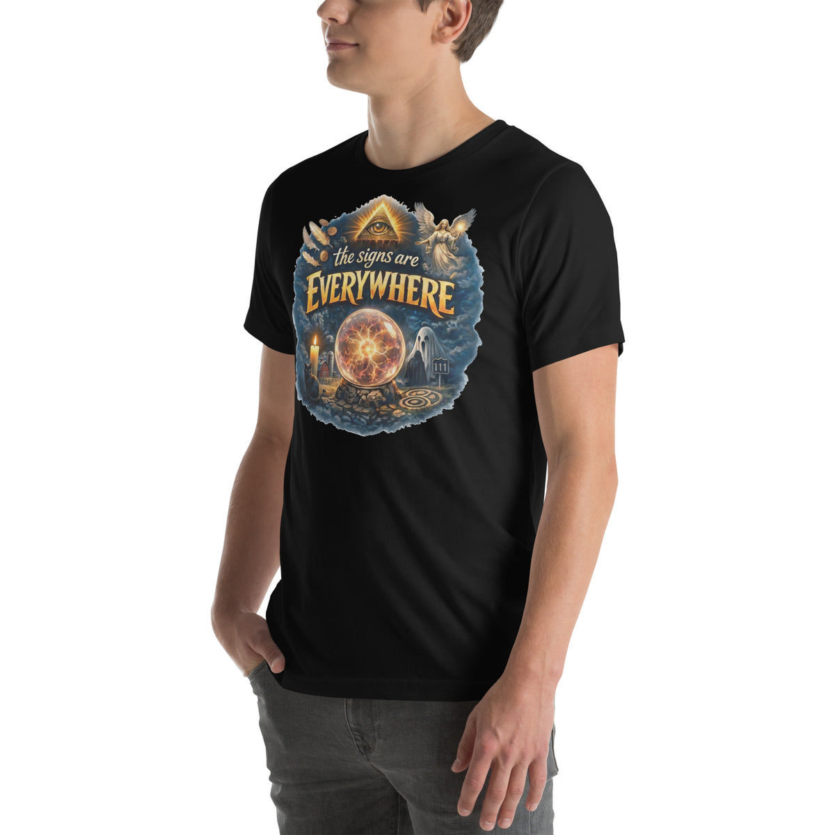 The Signs Are Everywhere design, an all-seeing eye, an angel, a crystal ball and a 111 road sign in gold, on a black unisex t-shirt worn by a model, angled to the left