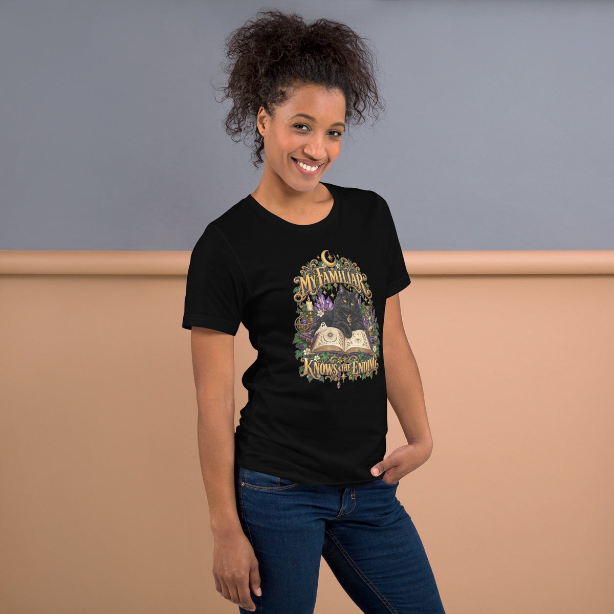 Black cat familiar on a grimoire, witchy celestial design on a black unisex t-shirt, right side