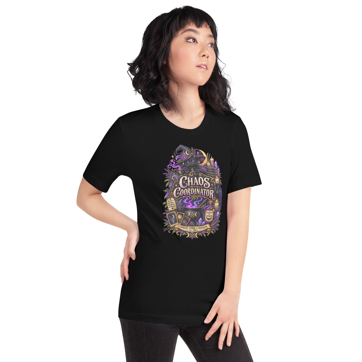 Chaos Coordinator whimsigoth design, a witchy black cat in a pointed hat, on a black unisex t-shirt, right front view