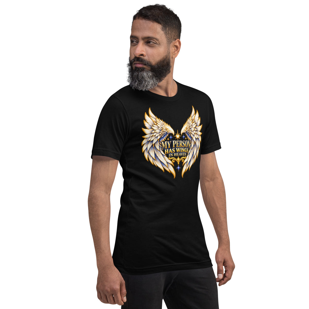 My Person Has Wings In Heaven design, gold and white angel wings curving into a heart around gold lettering with blue star sparkles, on a black unisex t-shirt worn by a model, angled to the right