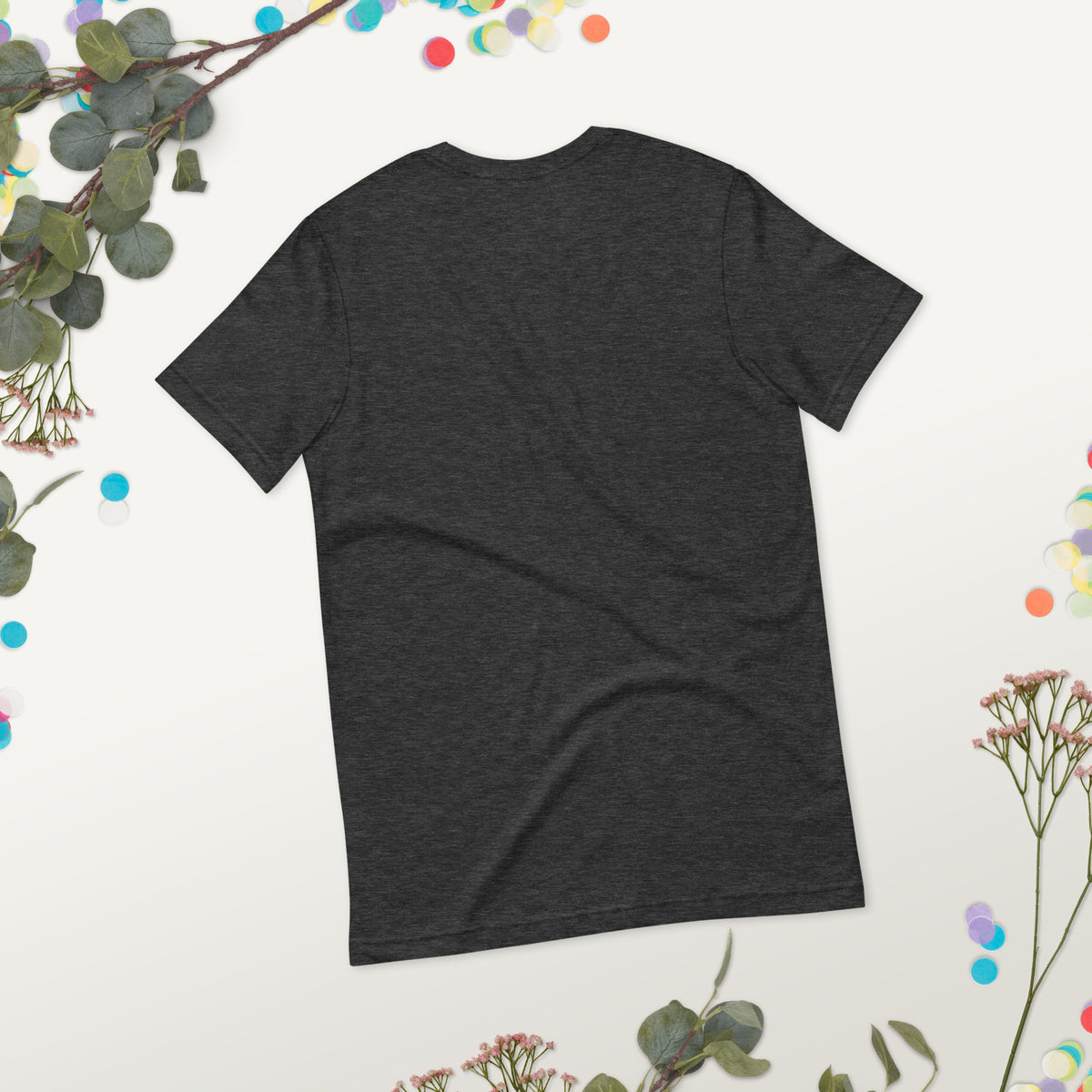 Love Gave You Wings design, on a dark grey heather unisex t-shirt, plain back view with no design, styled flat lay on a gray backdrop
