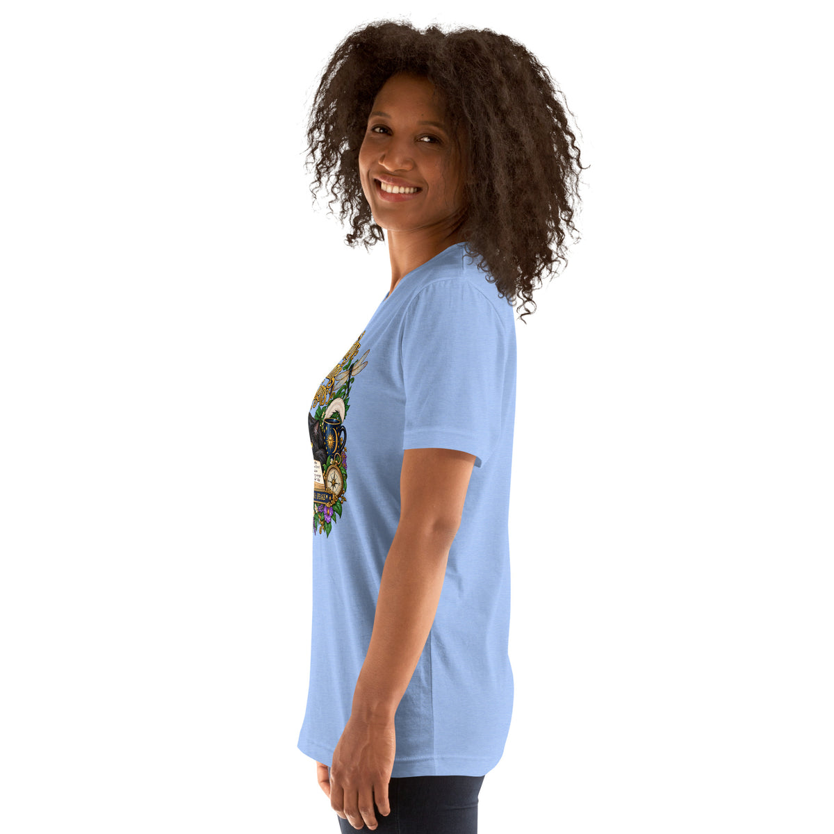 Currently Reading The Signs dark academia design, two black cats asleep over an open book beneath a crescent moon, on a heather carolina blue unisex t-shirt, left side view