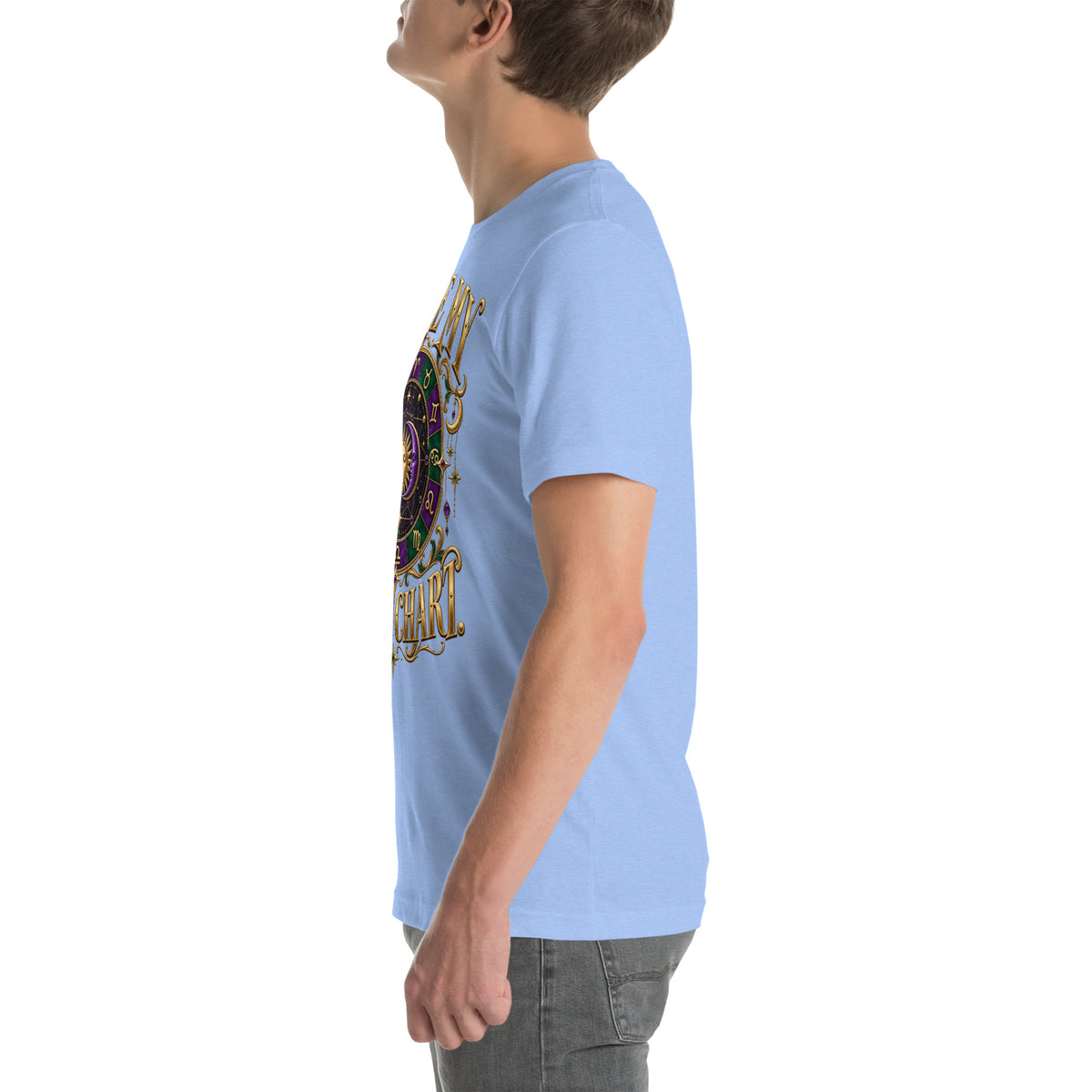 Blame My Birth Chart astrology design, a purple and green zodiac wheel with a gold sun face and crescent moon at its center, hung with gold ornaments, on a heather carolina blue unisex t-shirt, left side view
