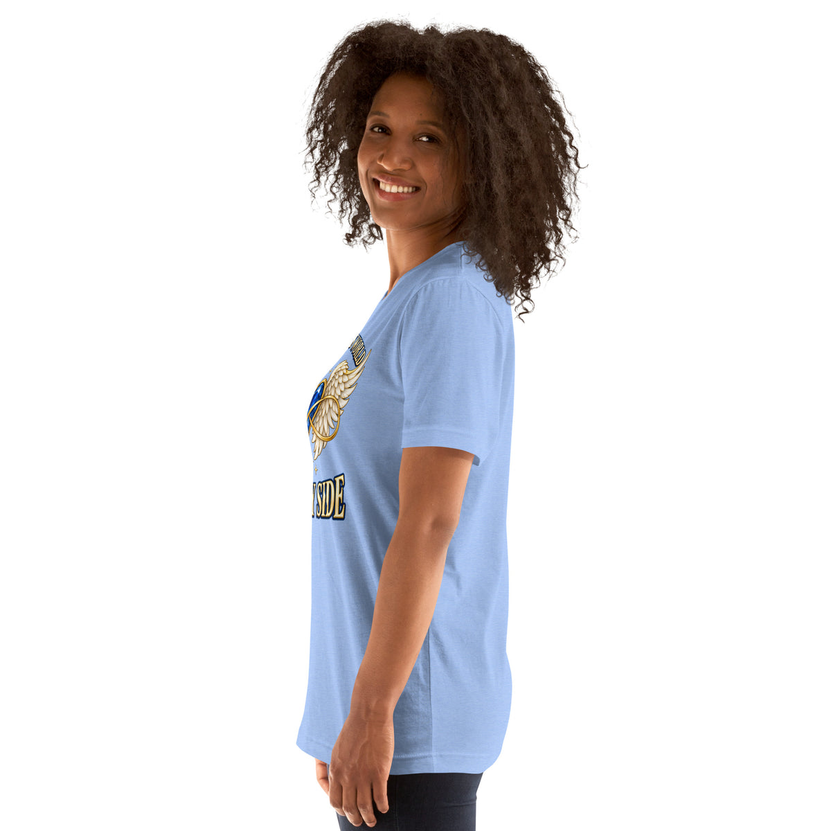 You Left This World Not My Side design, a blue gem heart with cream angel wings and a gold infinity ribbon under gold lettering, on a heather Carolina blue unisex t-shirt worn by a model, left side view