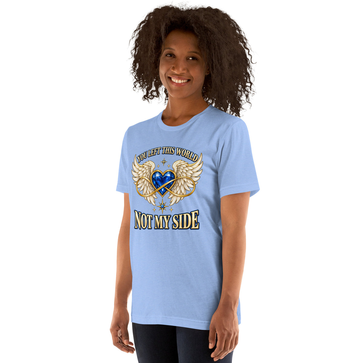 You Left This World Not My Side design, a blue gem heart with cream angel wings and a gold infinity ribbon under gold lettering, on a heather Carolina blue unisex t-shirt worn by a model, angled to the left