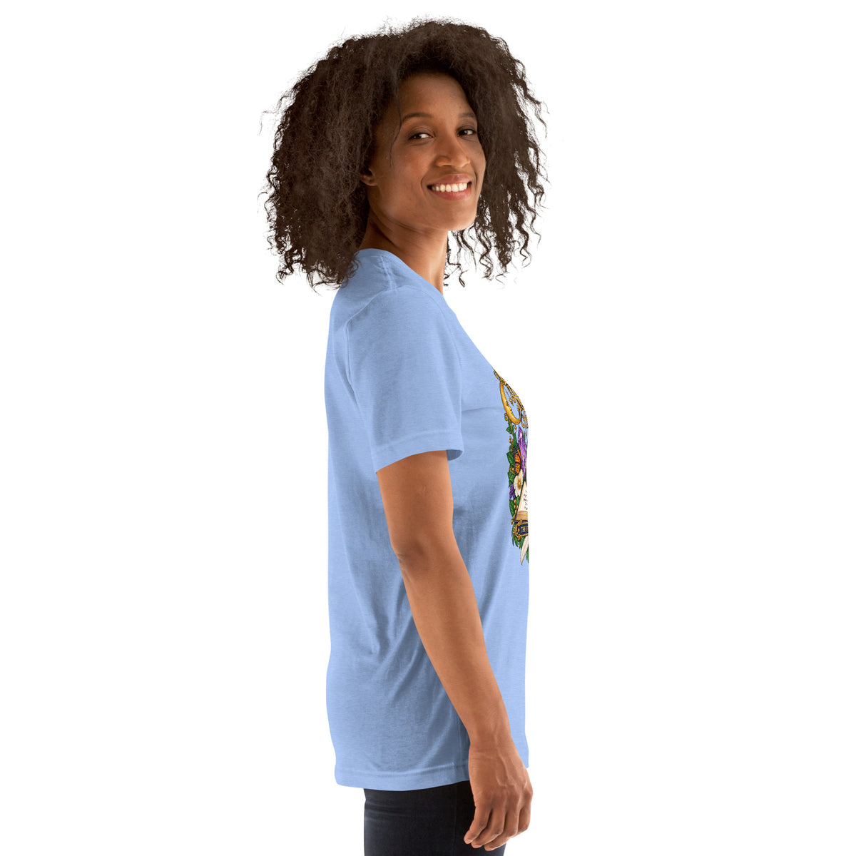 Currently Reading The Signs dark academia design, two black cats asleep over an open book beneath a crescent moon, on a heather carolina blue unisex t-shirt, right side view