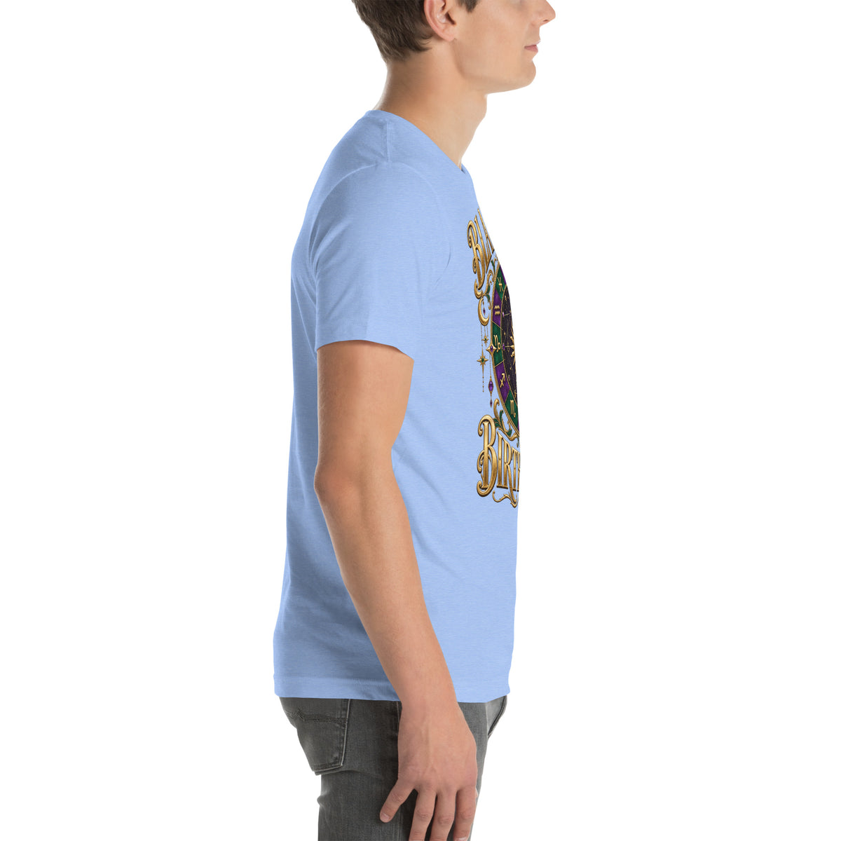 Blame My Birth Chart astrology design, a purple and green zodiac wheel with a gold sun face and crescent moon at its center, hung with gold ornaments, on a heather carolina blue unisex t-shirt, right side view