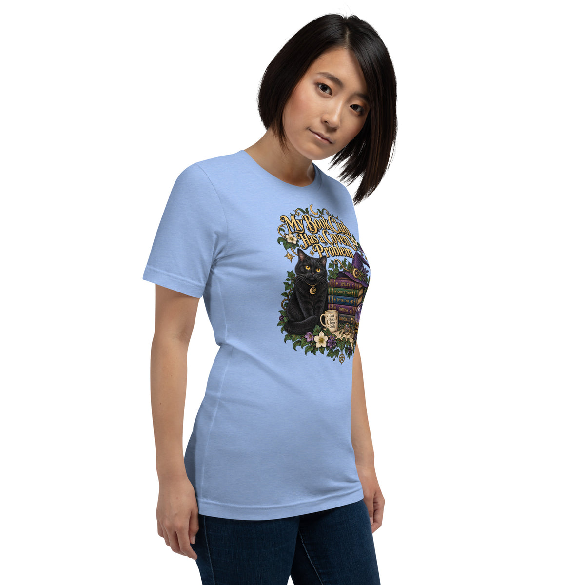My Book Club Has A Coven Problem dark academia design, a witchy black cat and a stack of spellbooks, on a heather carolina blue unisex t-shirt, right front view