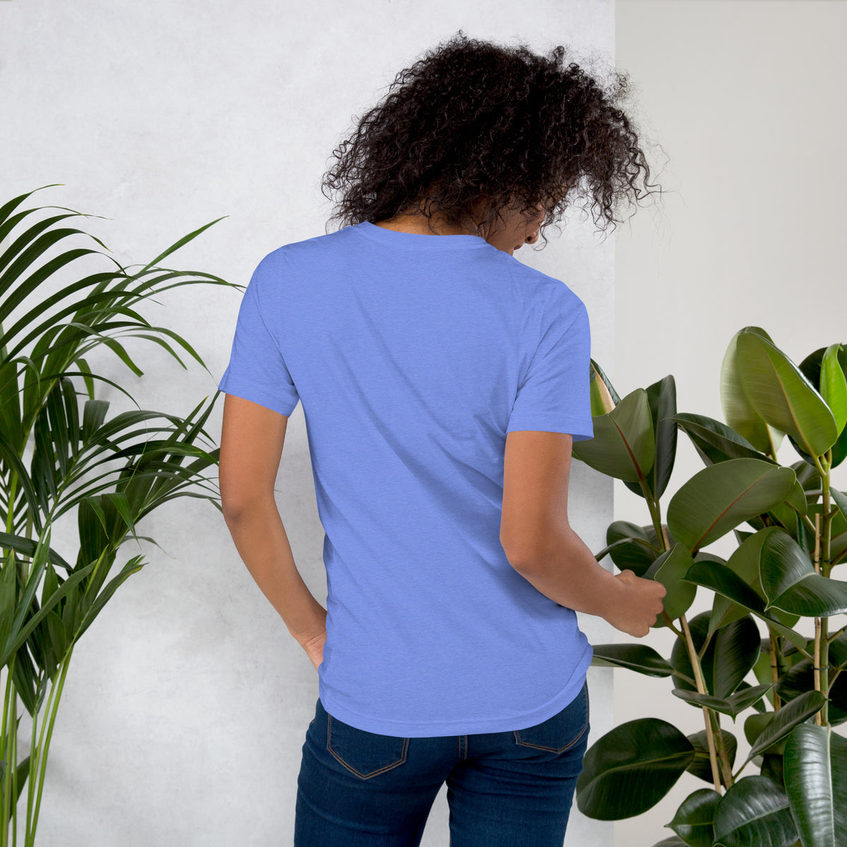 Own Your Grounded Energy design, an ornate tree with gold leaves and crystals in its roots, on a heather columbia blue unisex t-shirt, back view