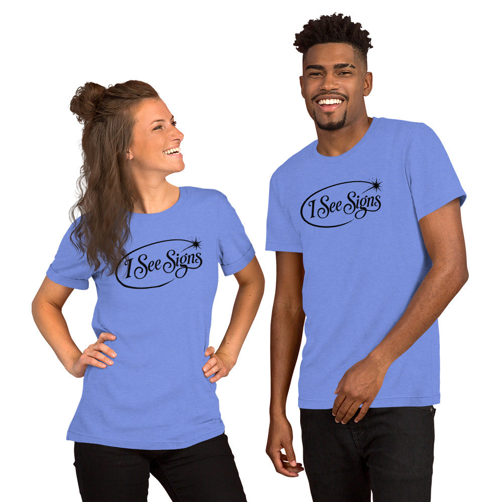 I See Signs design, the words set in black script inside a thin oval with a four-pointed star, on a heather columbia blue unisex t-shirt, front view