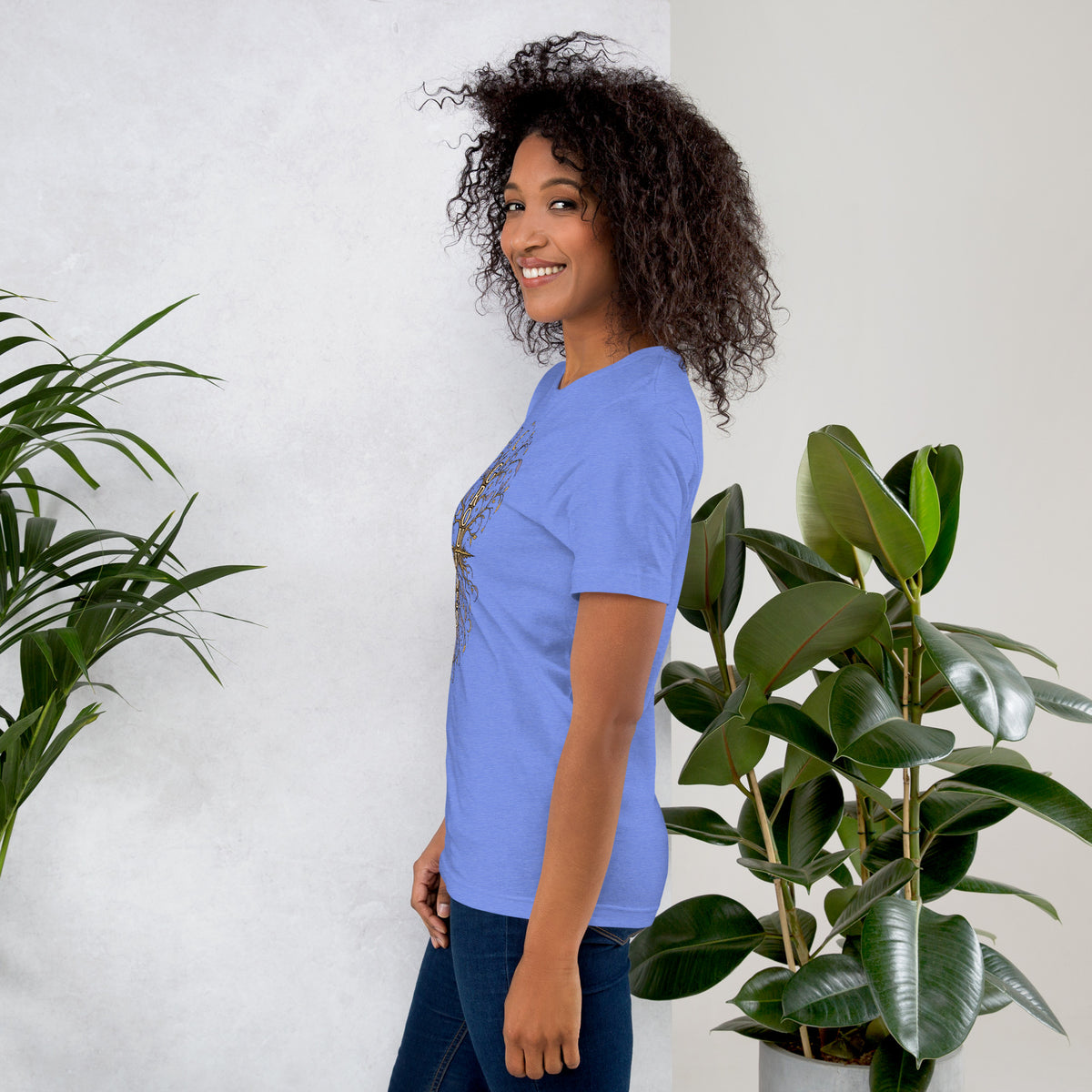 Own Your Grounded Energy design, an ornate tree with gold leaves and crystals in its roots, on a heather columbia blue unisex t-shirt, left side view