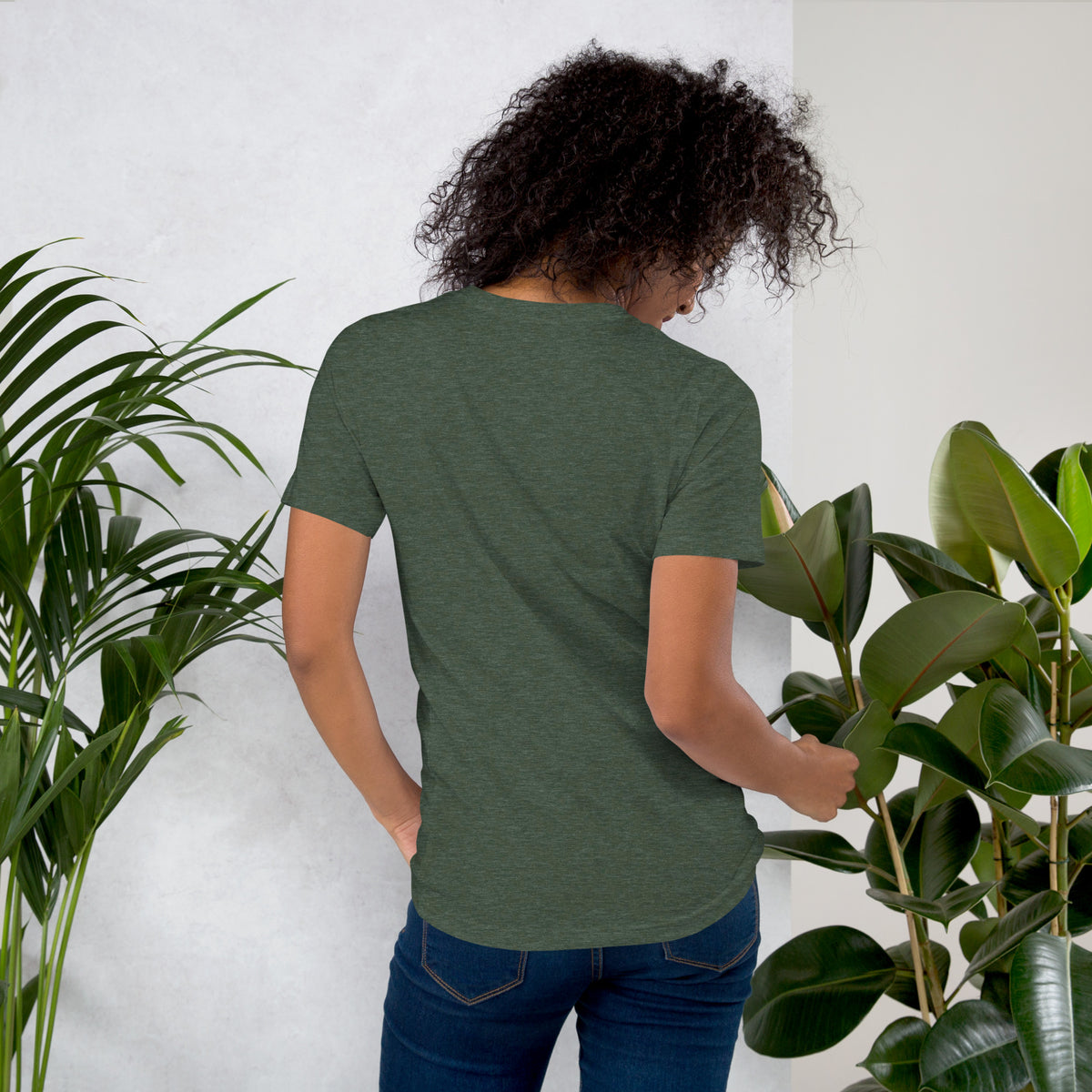 Apothecary of Questionable Intentions, a witchy black cat and two dozen potion bottles, on a heather forest unisex t-shirt, back view