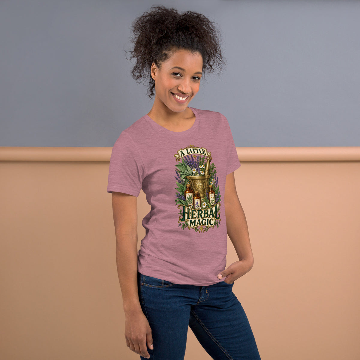 A Little Herbal Magic design, a gold mortar and pestle filled with lavender and chamomile, on a heather orchid unisex t-shirt, right side view