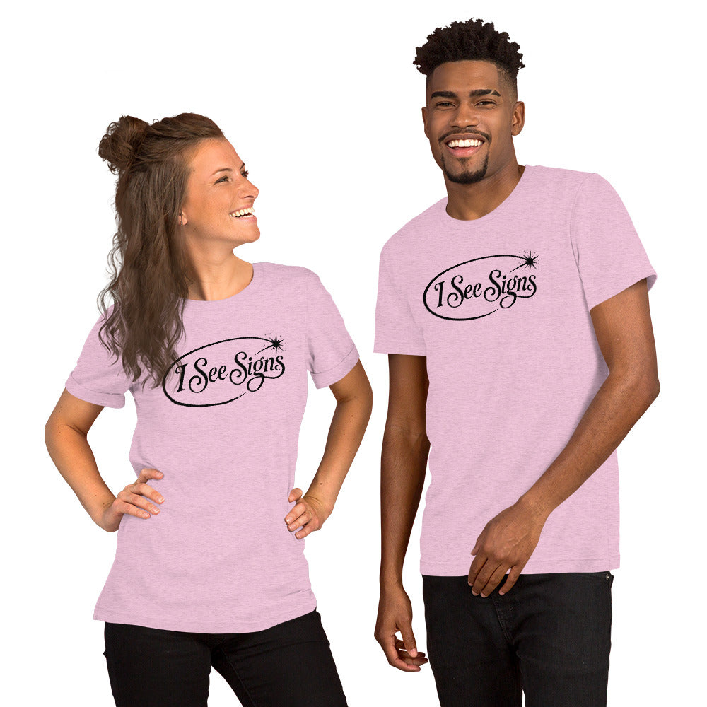 I See Signs design, the words set in black script inside a thin oval with a four-pointed star, on a heather prism lilac unisex t-shirt, front view