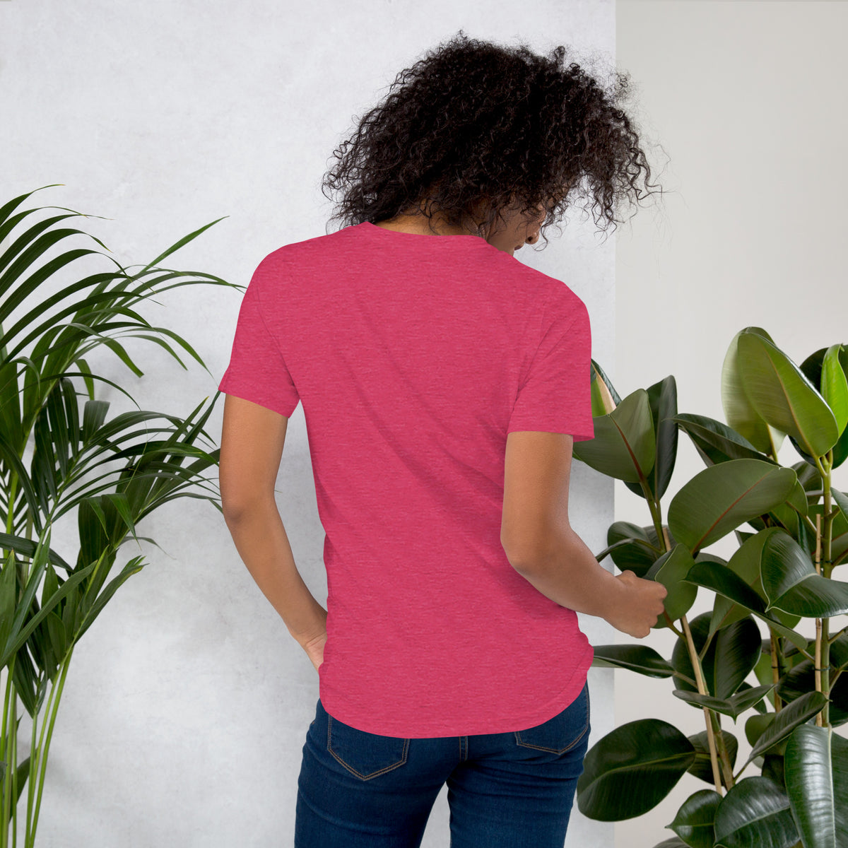 Own Your Grounded Energy design, an ornate tree with gold leaves and crystals in its roots, on a heather raspberry unisex t-shirt, back view