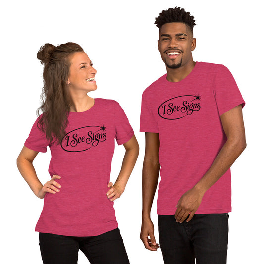 I See Signs design, the words set in black script inside a thin oval with a four-pointed star, on a heather raspberry unisex t-shirt, front view